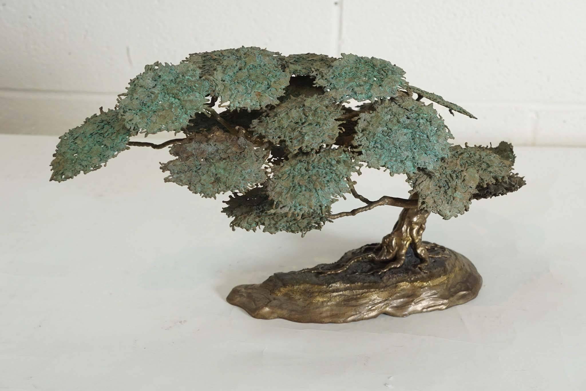 Here is an amazing Serengeti tree in a Brutalist style.
The small scale of the sculpture also appears to look like a bonsai.
The brass is in brass and the foliage has a textured oxidized patina.