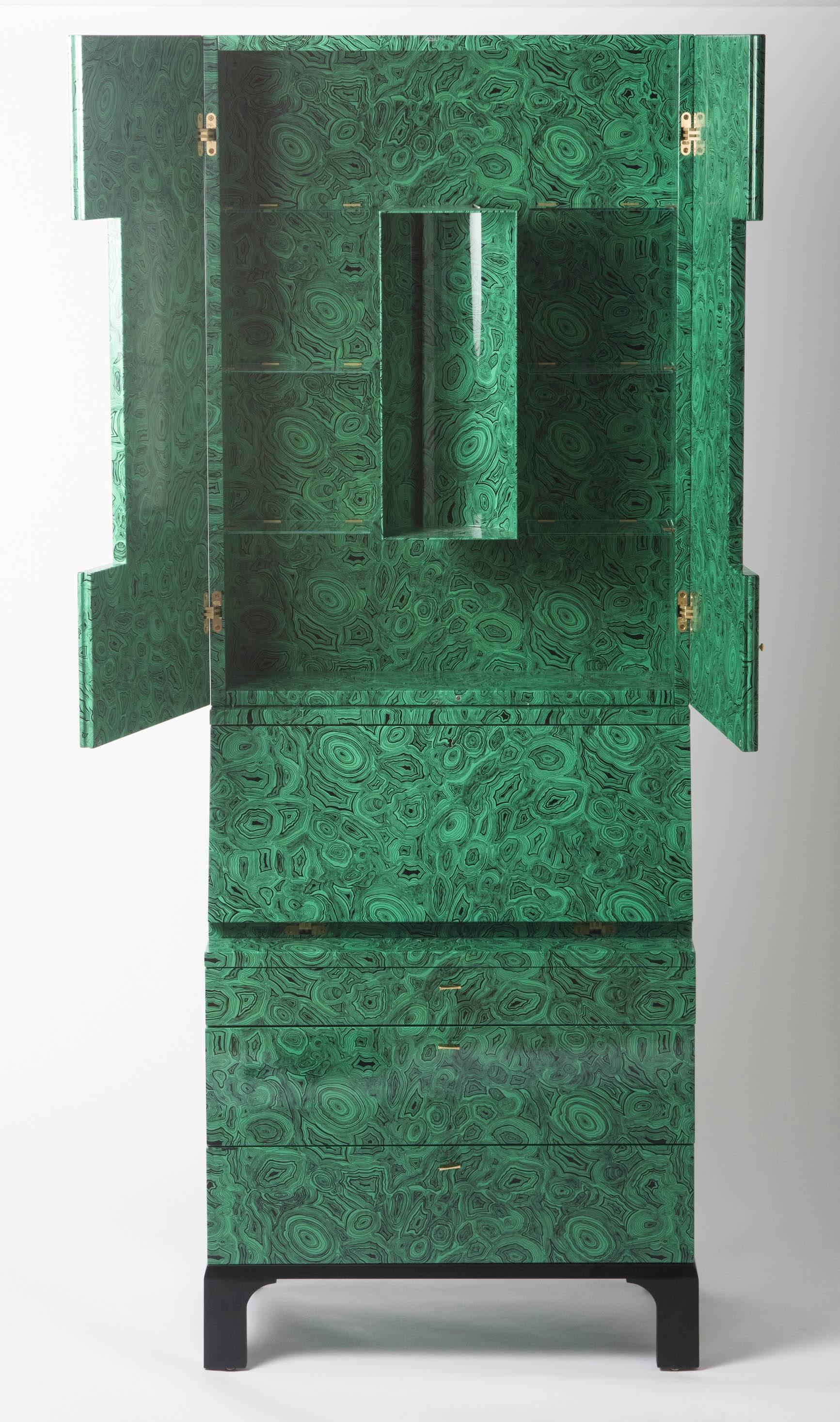 A Fornasetti “Malachite” trumeau cabinet by Ateliers Fornasetti.
Lithographically printed on hand colored lacquer,
wood.
The cabinet marked with atelier label to upper drawer and labelled to lower side.
No1 of 3, 2010,
Italy.
Measures: 218 cm