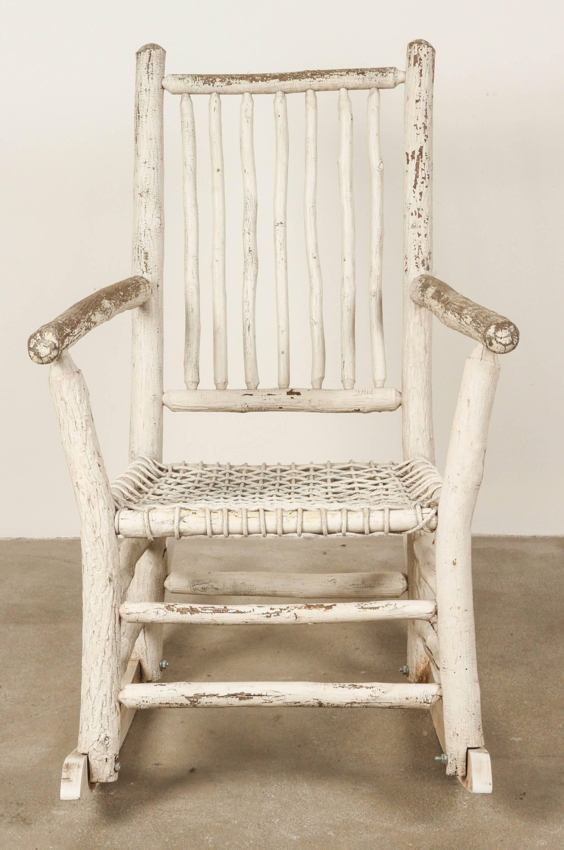 Log style rustic painted rocking chair.