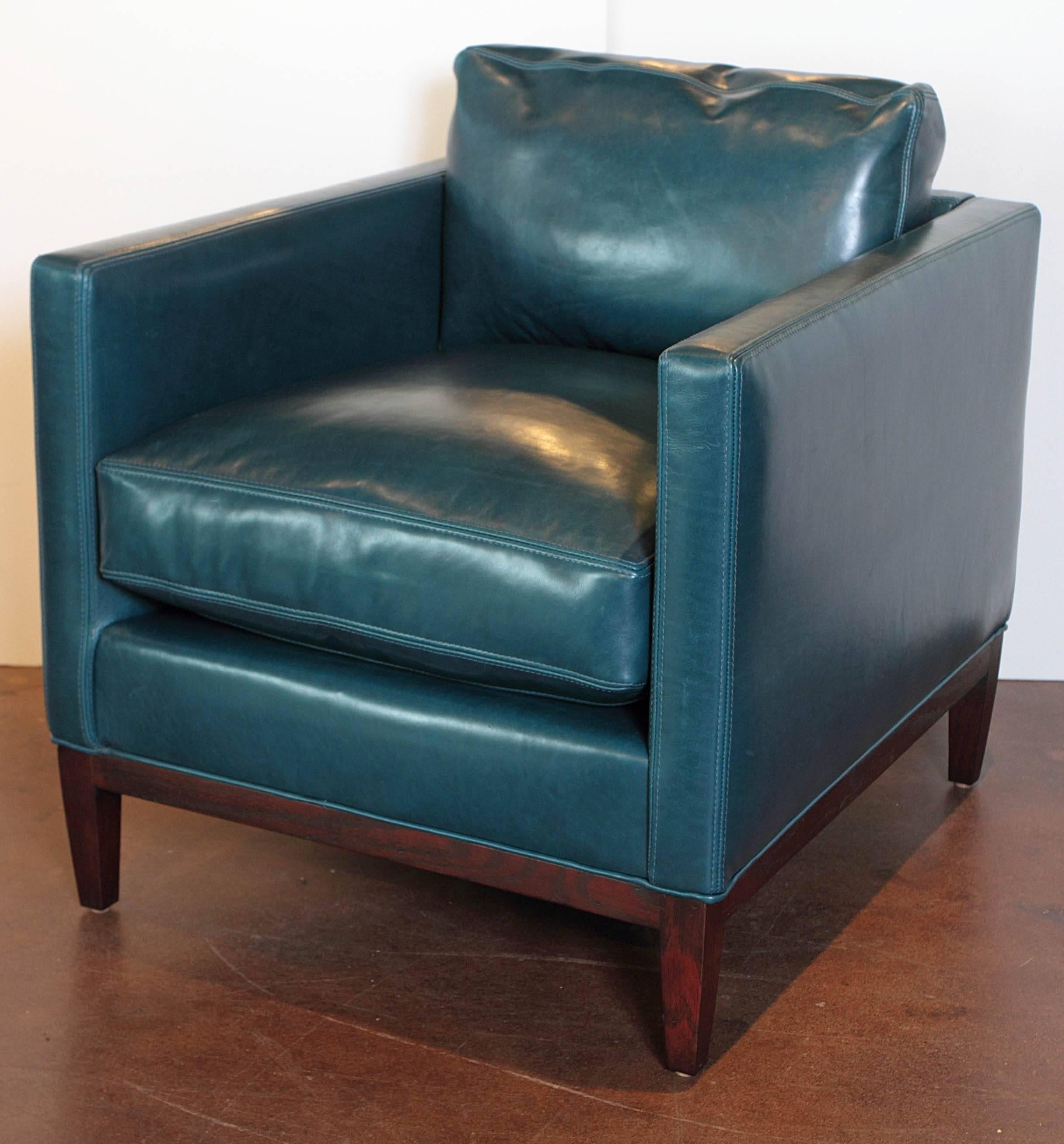 Parisian blue leather lounge chair.
Brand: LEE.

Parisan blue leather with vintage chestnut frame, on a cloud nine cushion filled package.

Measurements: Arm height 26