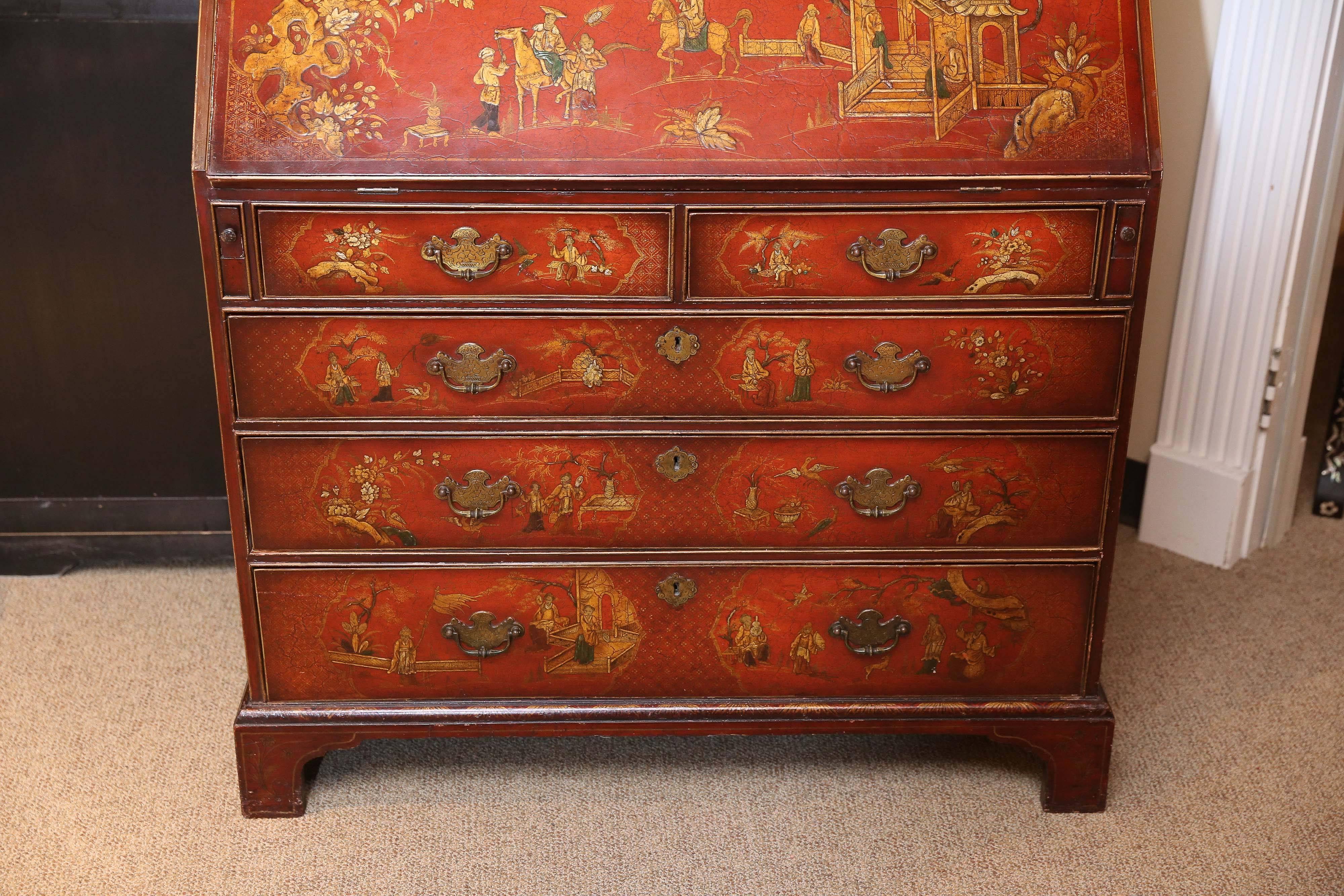 Very Fine English made slant front chinoiserie secretary. Red lacquered and
Hand-painted on all sides. This piece is well made by Charles Tozer.
It has a well fitted interior with hidden drawers. It has a broken arch 
Pediment and made in the