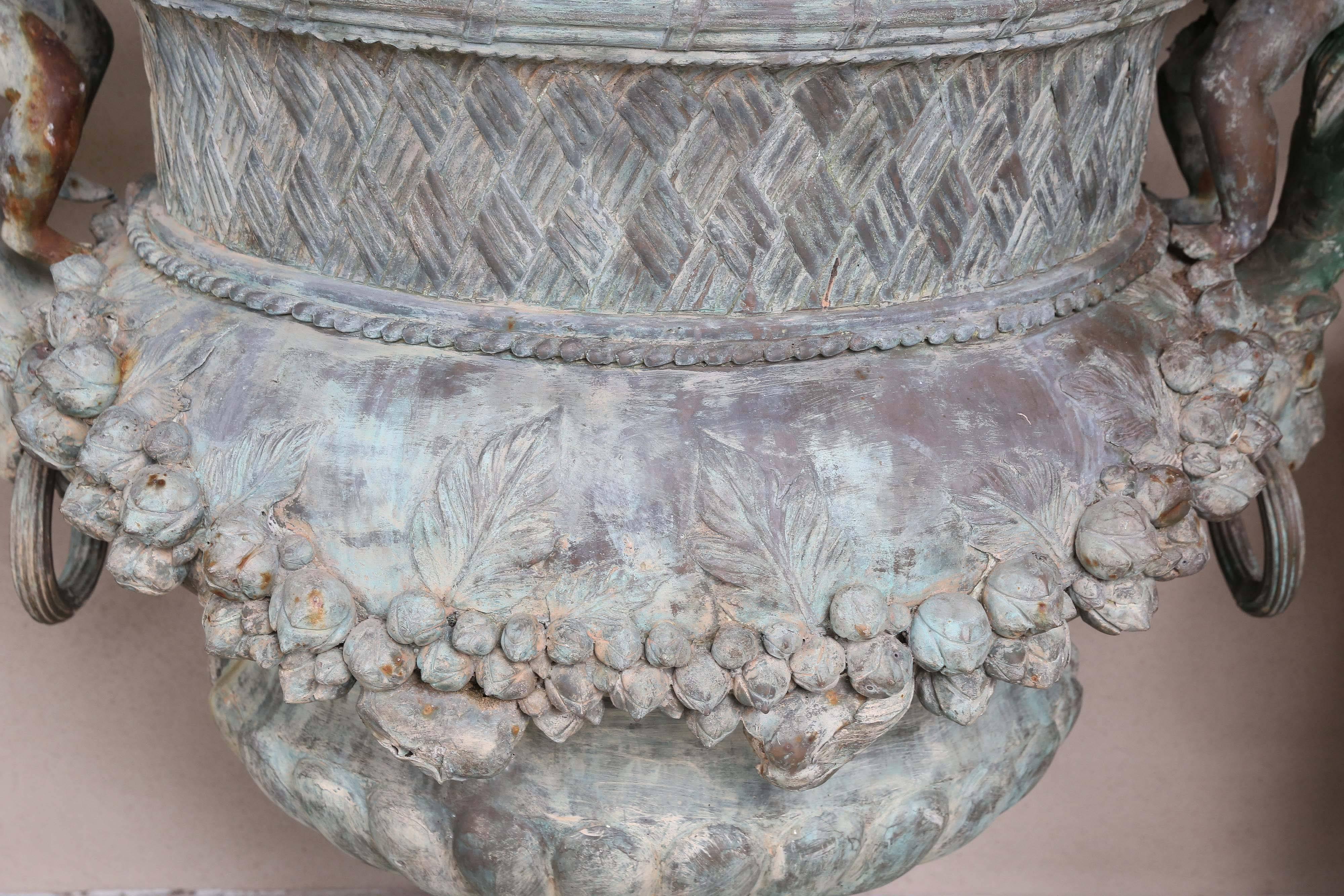 Pair of Verde Patinated Large Bronze Planters with Winged Cherubs and Garland 1