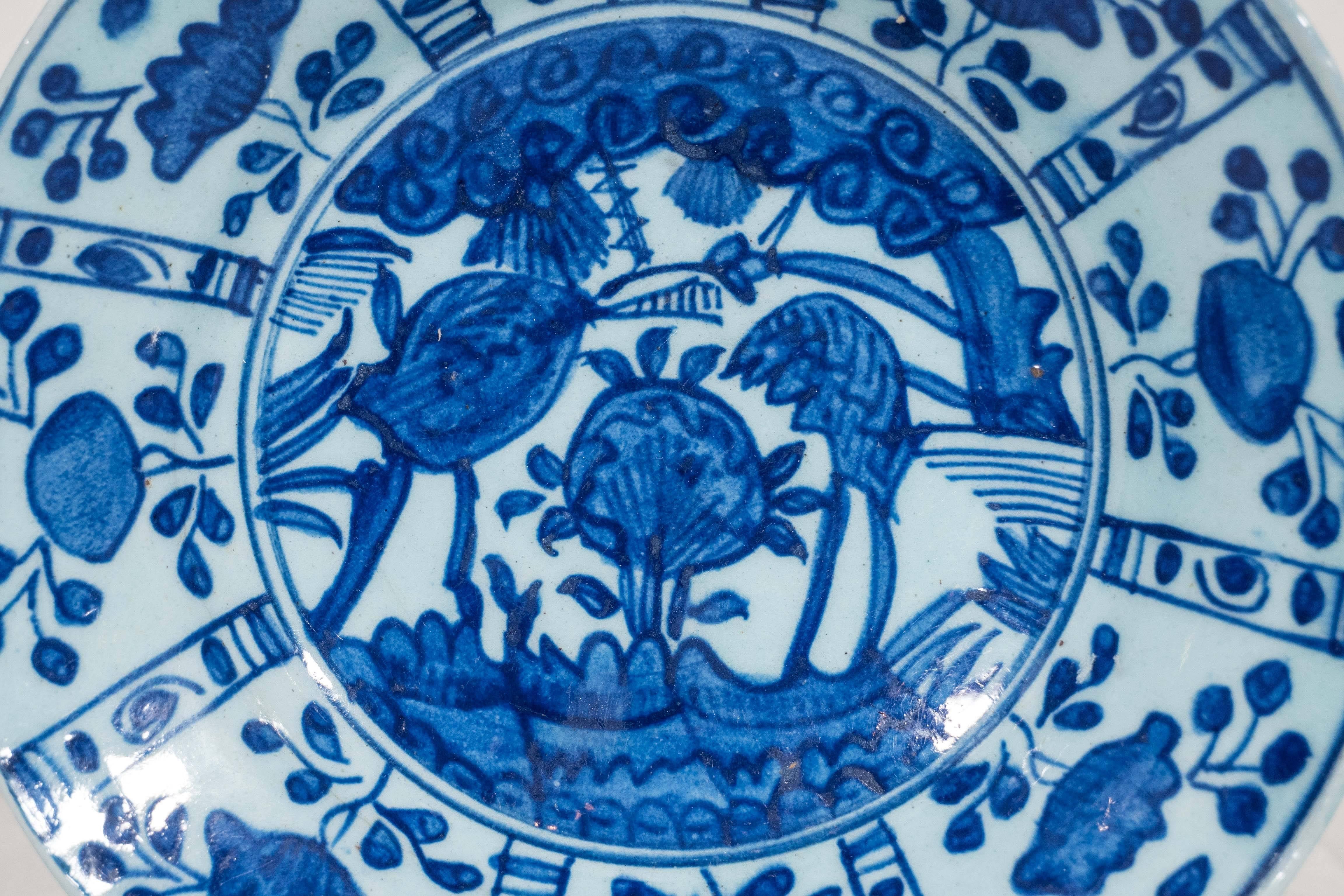 A blue and white Kütahya pottery dish with decoration inspired by Chinese 17th century design. Kütahya pottery began in the 16th century. From early on the forms were naive and free flowing rather than formal. 
Made during the Ottoman Empire, in