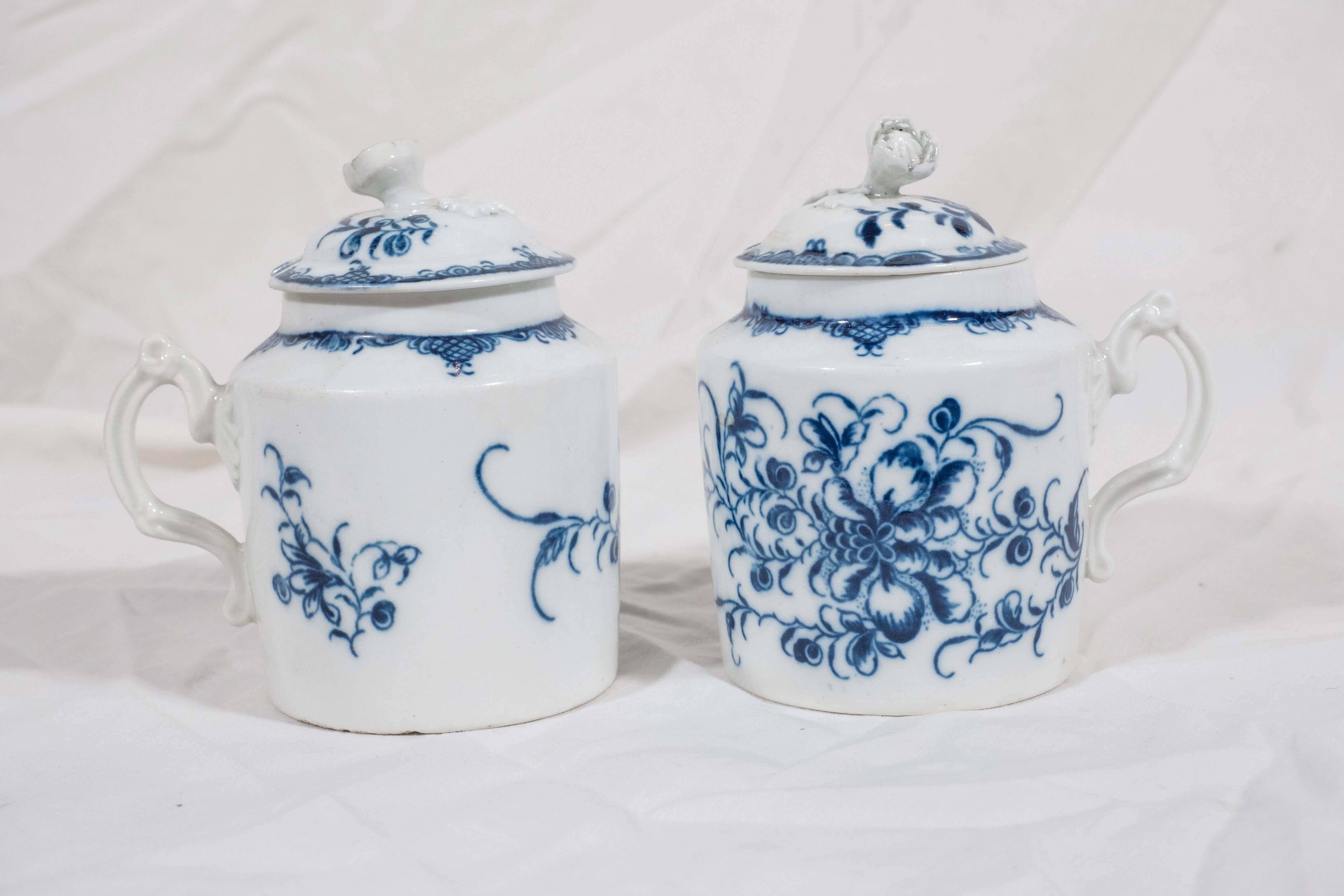 We are pleased to offer this pair of Blue and White porcelain mustard pots made in Shropshire, England by the Caughley China Works in the late 18th century. The pots are decorated in underglaze blue with a pattern of peonies and scrolling vines. The