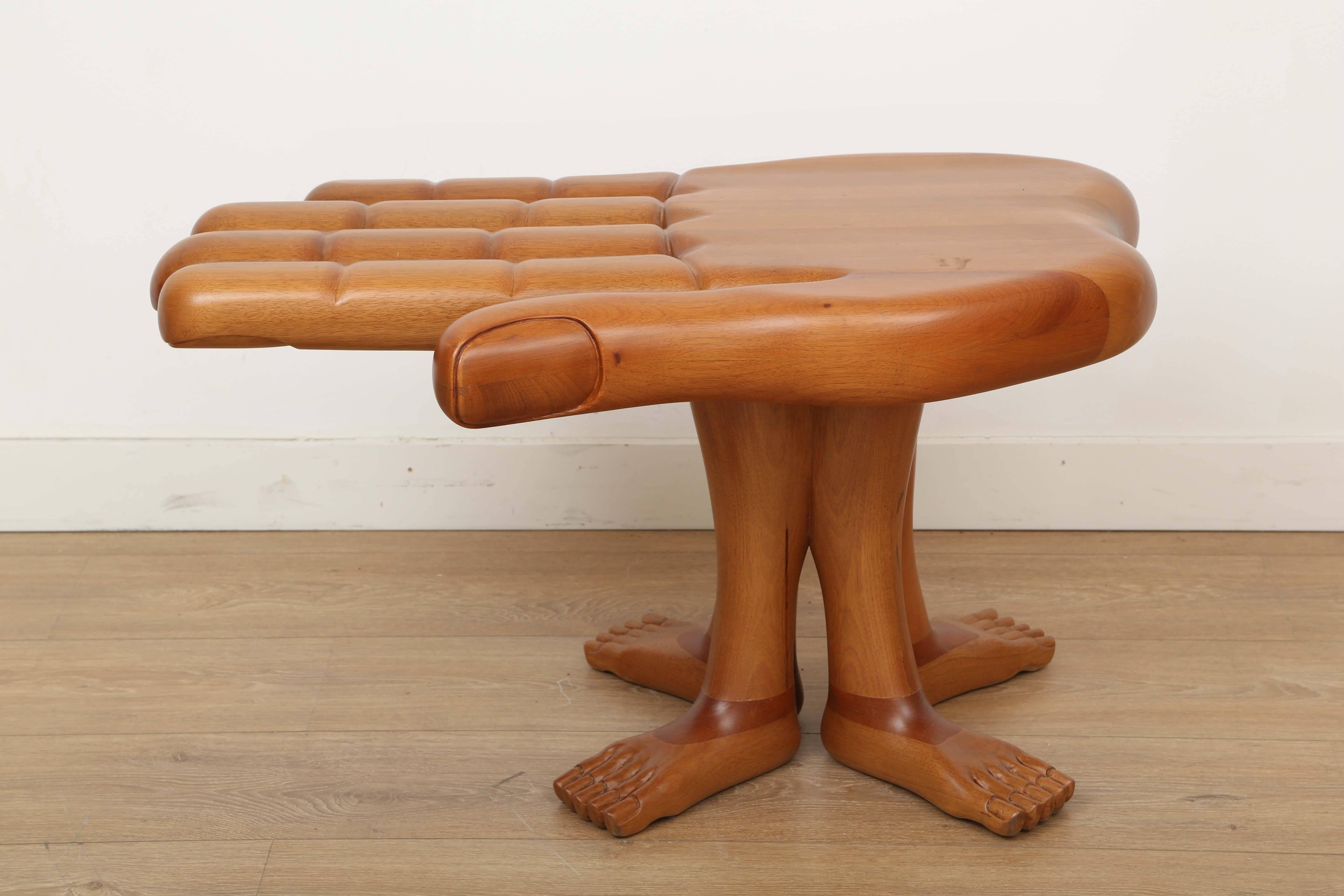 Iconic modern hand and foot side table or sculpture by Mexican surrealist artist Pedro Friedeberg. Executed and carved with laminated and blocked mahogany. Signed.