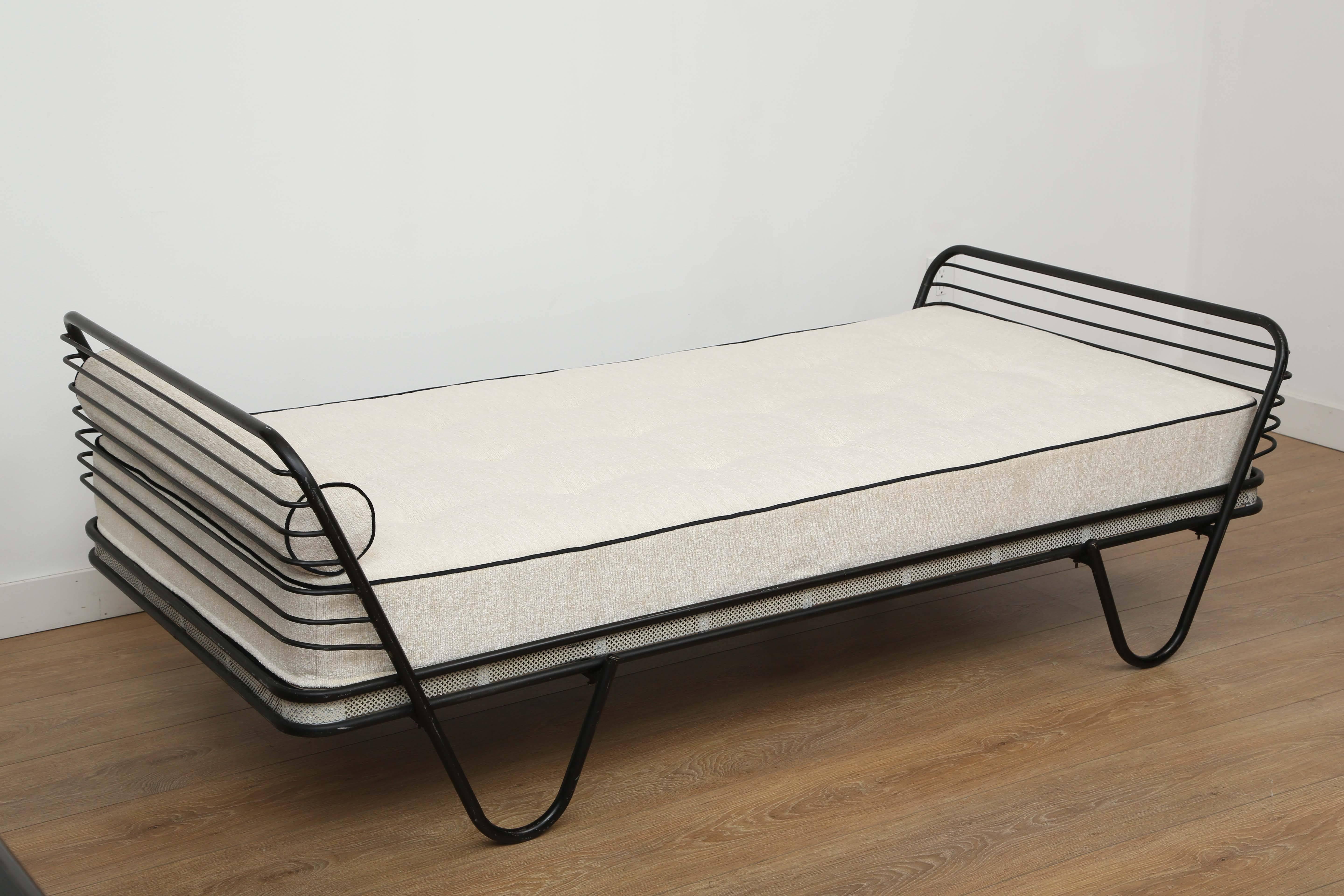 French Mid-Century Modern pair of daybeds, Kyoto model by Mathieu Matégot.
Tubular black enameled steel frame and white perforated metal gallery with new custom-made mattress. Newly upholstered with an off white boucle with black piping.
Price is