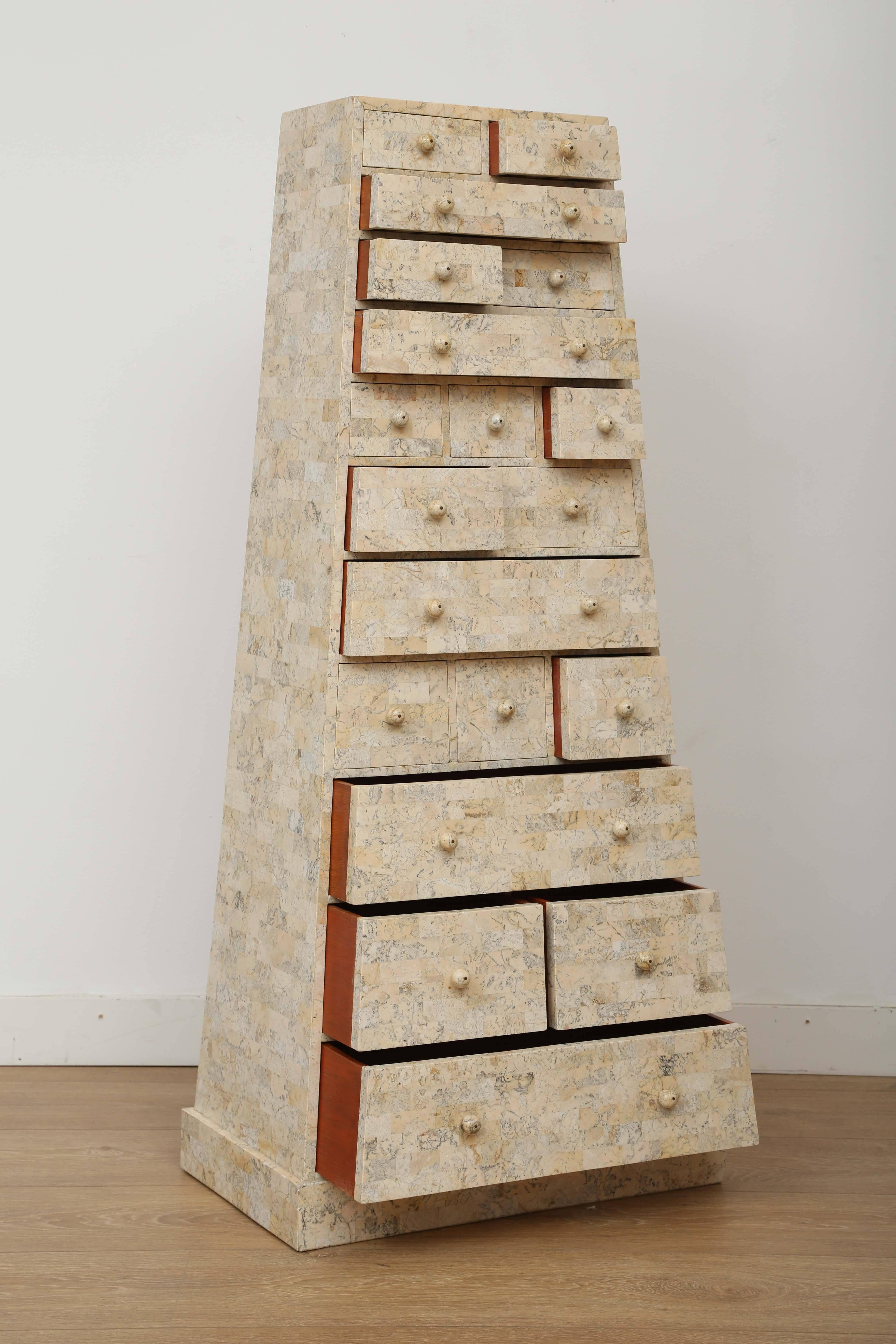 Tall multi (19) drawers cabinet. Exceptionally finished on all sides with tesselated stone tiles by Maitland Smith (brass plaque).
Top W 14
