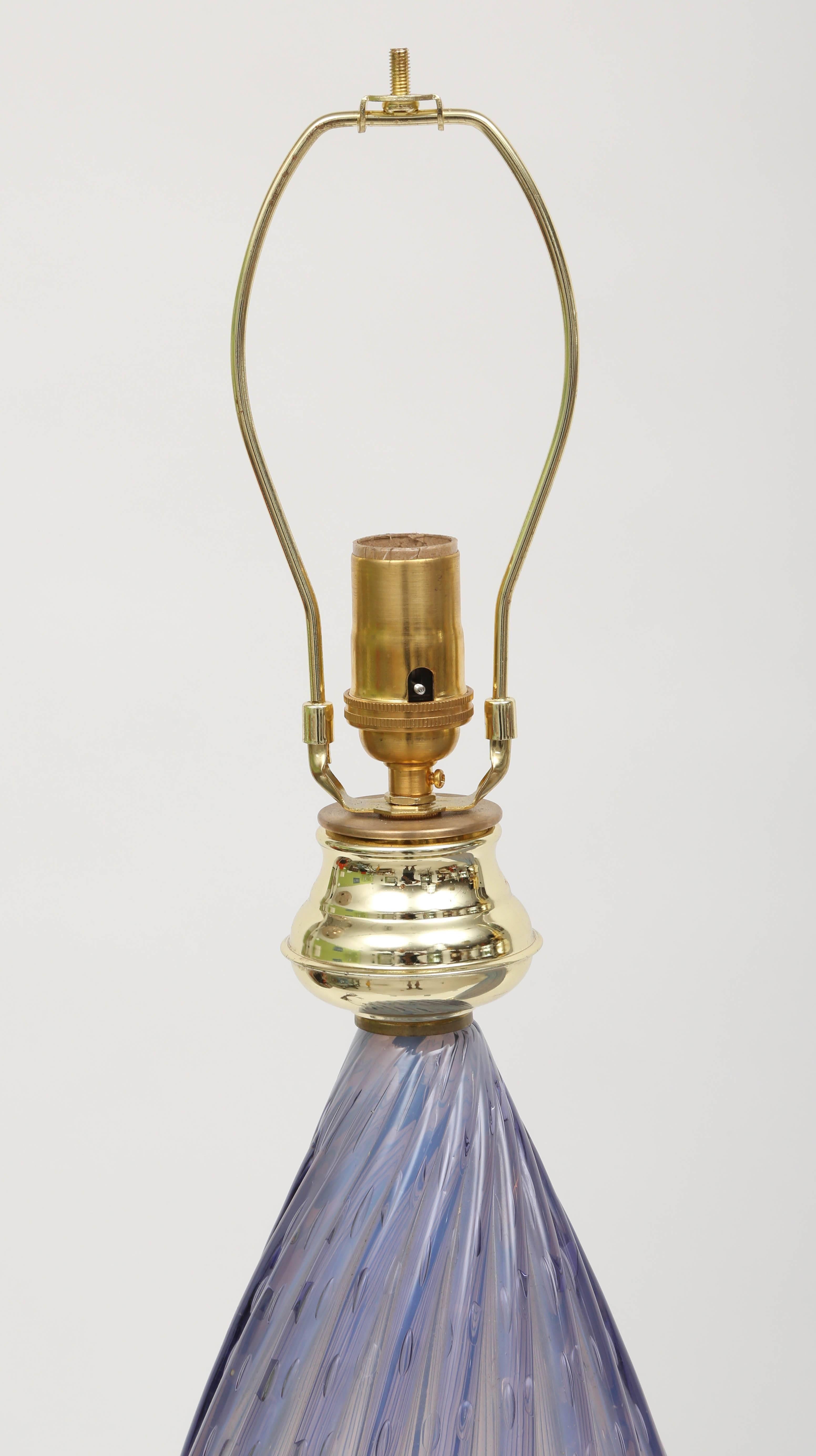 Pair of vintage periwinkle Murano glass table lamps with controlled bubble technique and brass accents. Made by Barbini. The height is 30" to top of finial.