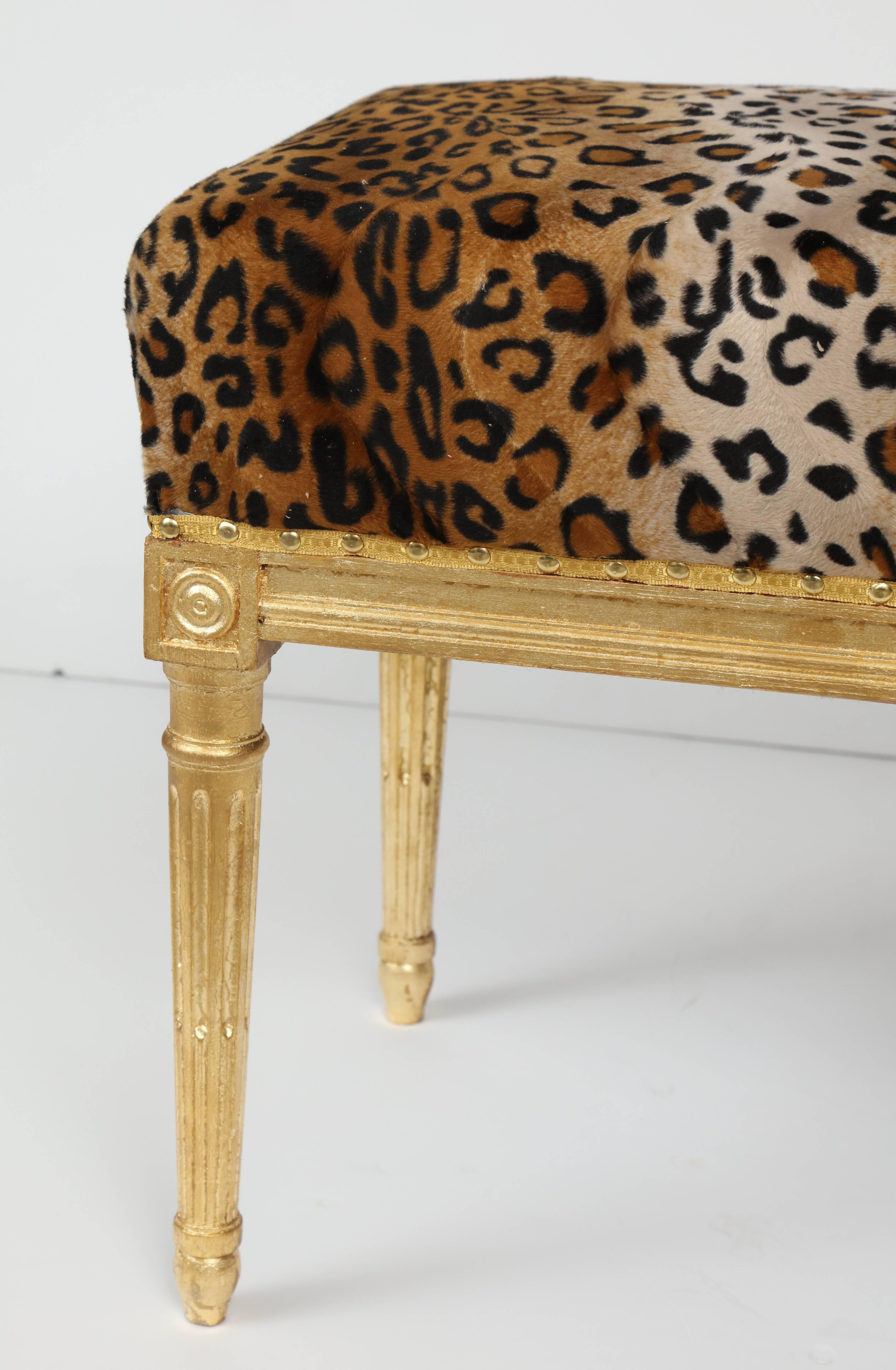 Everyone needs a little animal skin print somewhere! We think the perfect place for a leopard print is on this chick Louis XVI style bench. The base has fluted, tapered legs characteristic of the Louis XVI style and the leopard print is finished