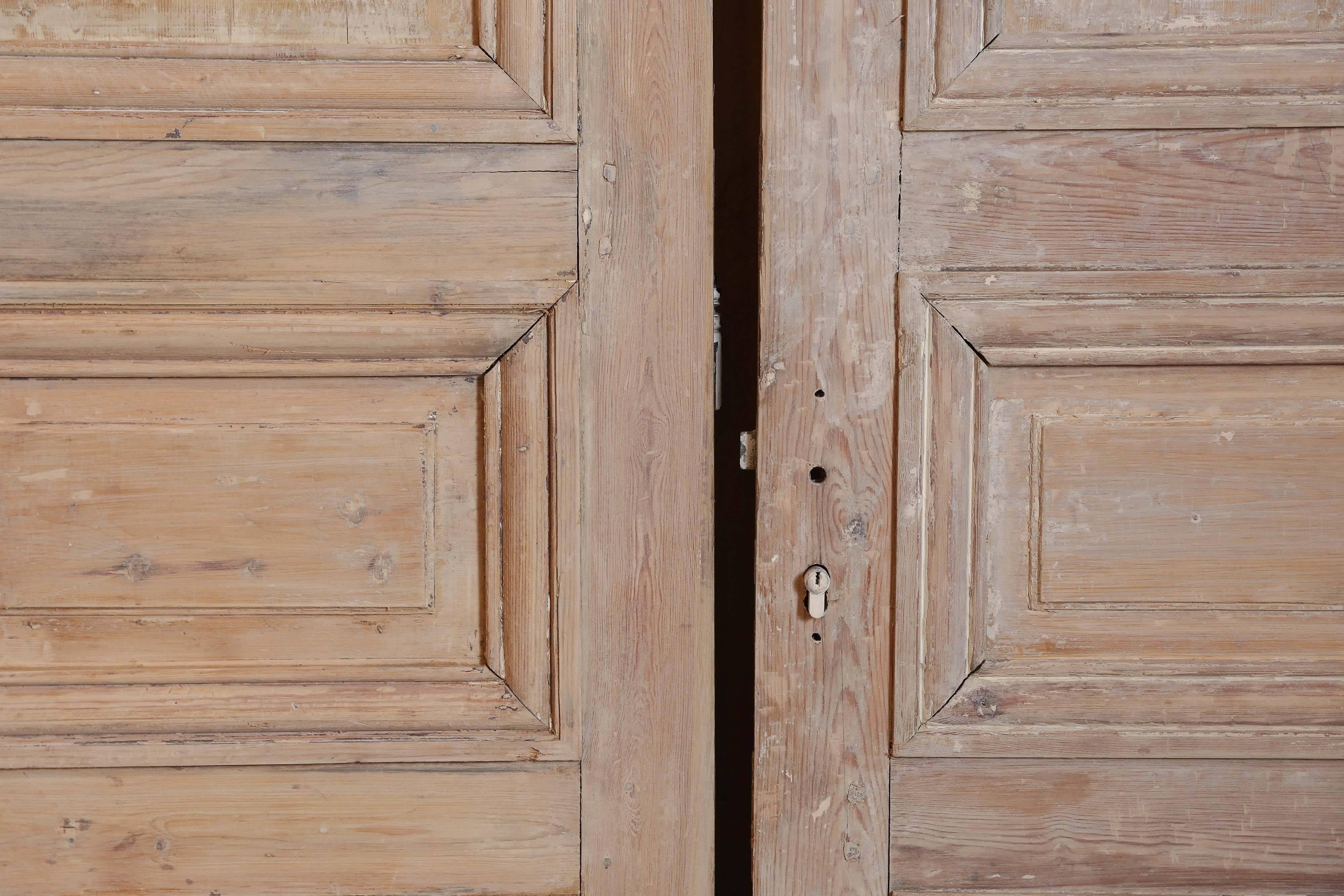 Pair of Louis XVI doors in stripped pine. Each door is 28.5