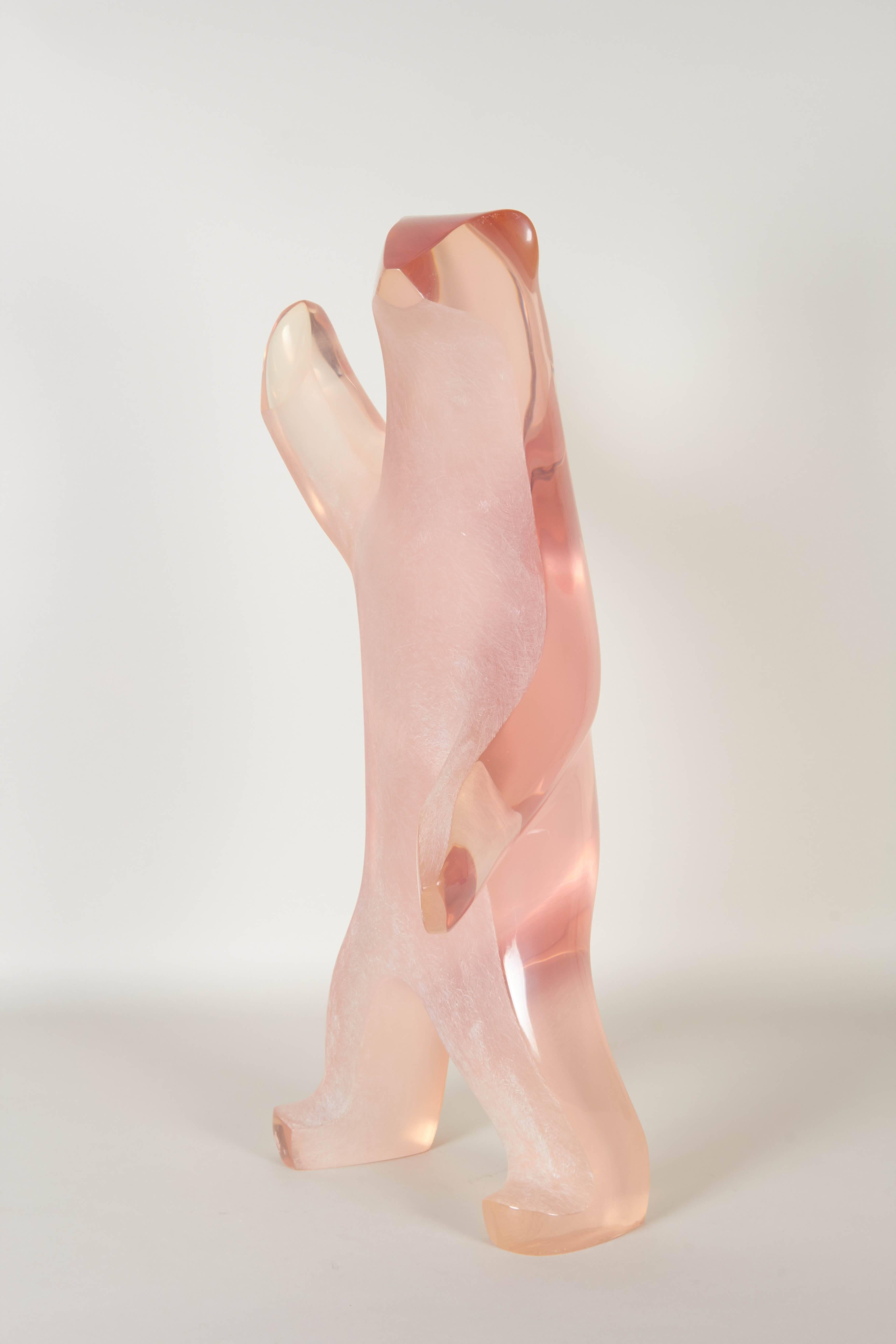 A modern, minimalist style sculpture, depicting a walking bear in pink clear Lucite, with etched detail to the front, produced by artist Louis Von Koelnau. Markings include [Louis Von Koelnau 1989/No. 85 of 200], signed to the foot. The sculpture