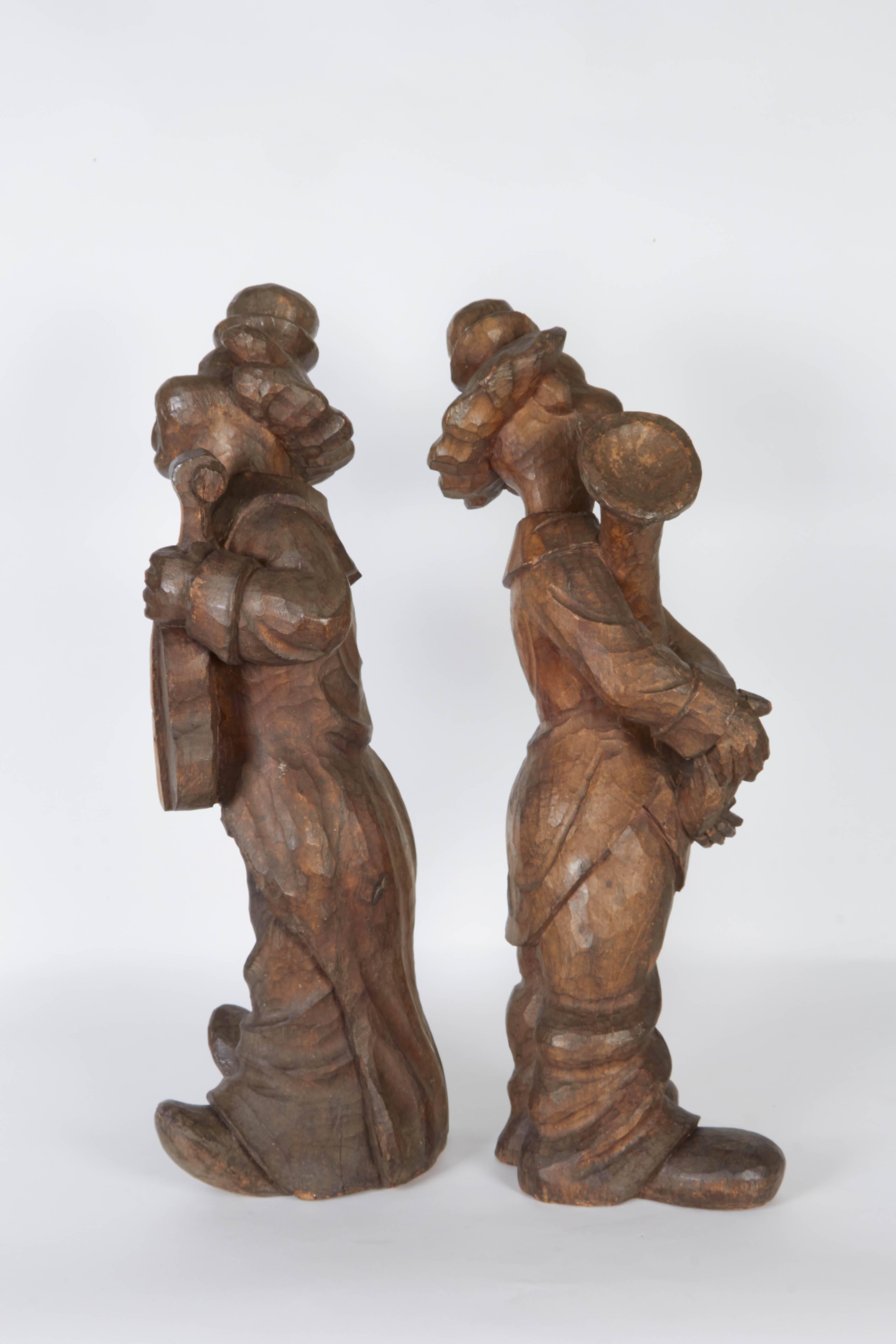 Early 20th Century Pair of 1920s Solid Carved Wood Clown Figures