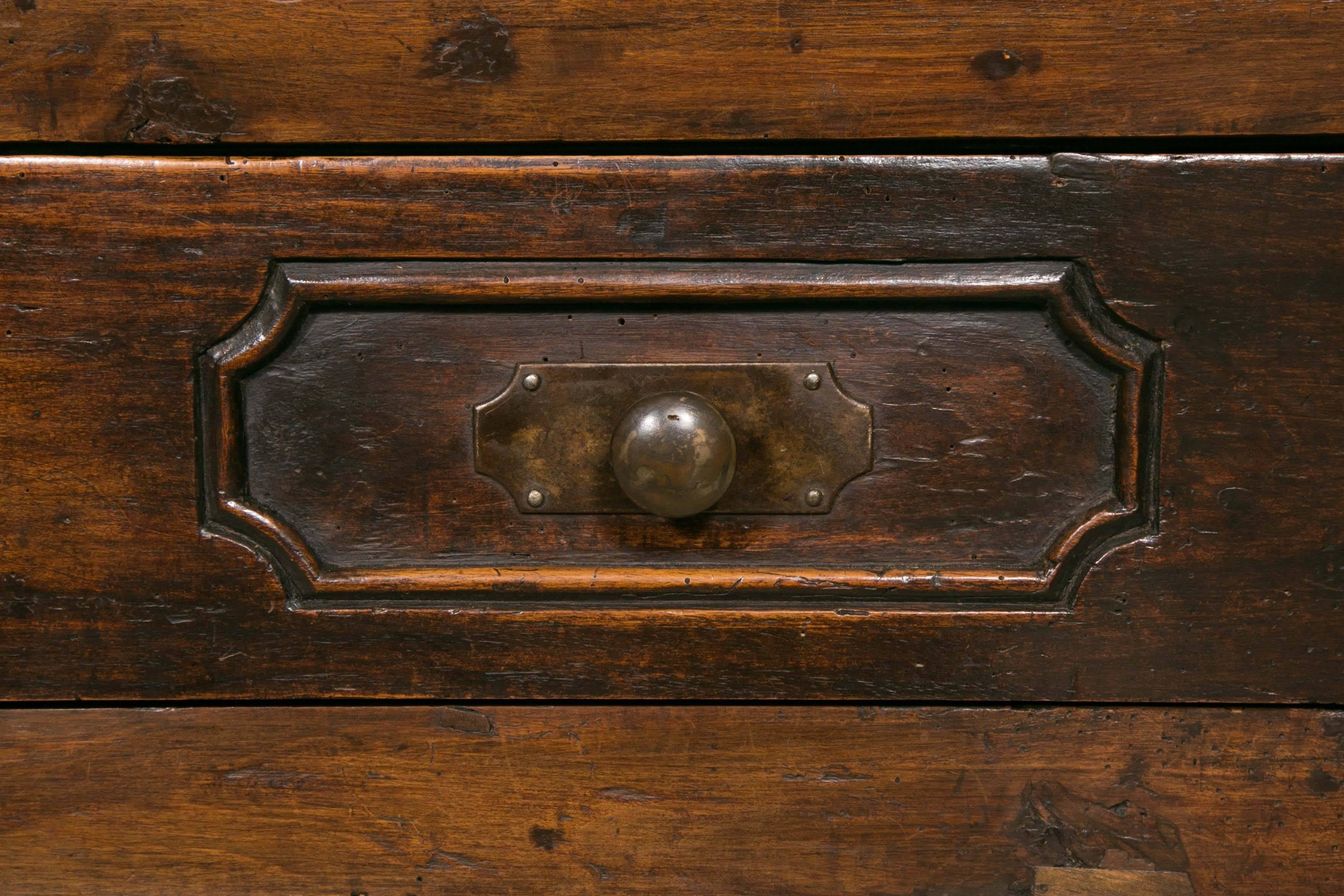 Fabulous walnut commode from the 18th century, Continental, period Louis XV with three drawers.
 