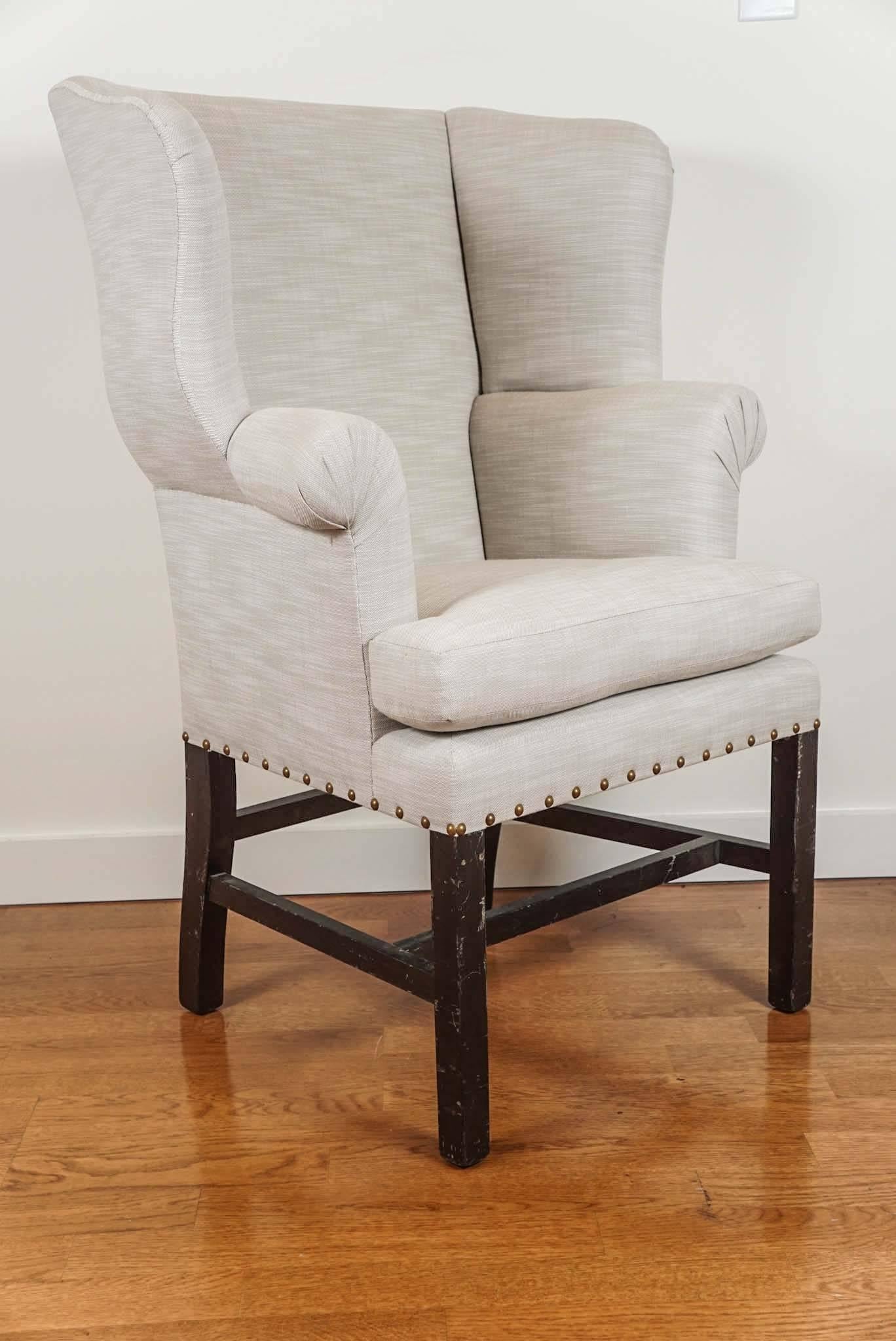 Charming petite wingback chair, newly upholstered in an oatmeal linen fabric, with beautiful, 