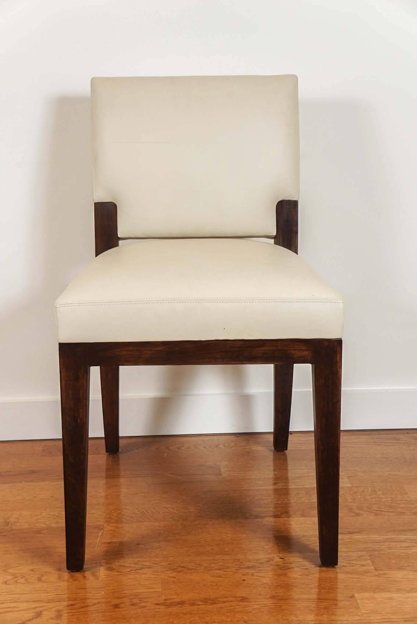 Wood, dining chair, with cream leather upholstery.