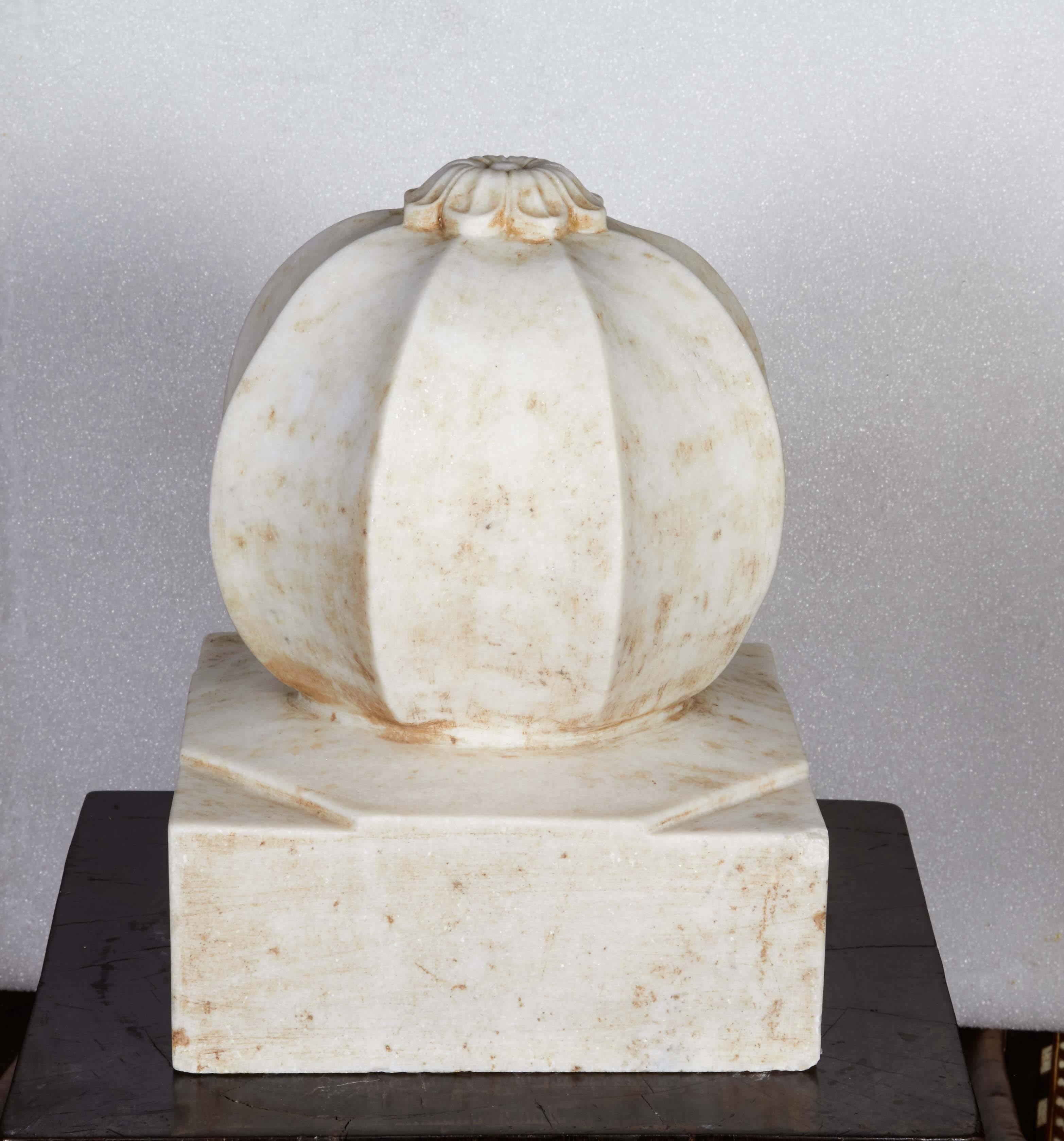 A large carved white marble carpet weight from India in a Classic orb style. Can also be used as a decorative element for patios, gardens and decks. Circa 1950. Two available, sold separately. 