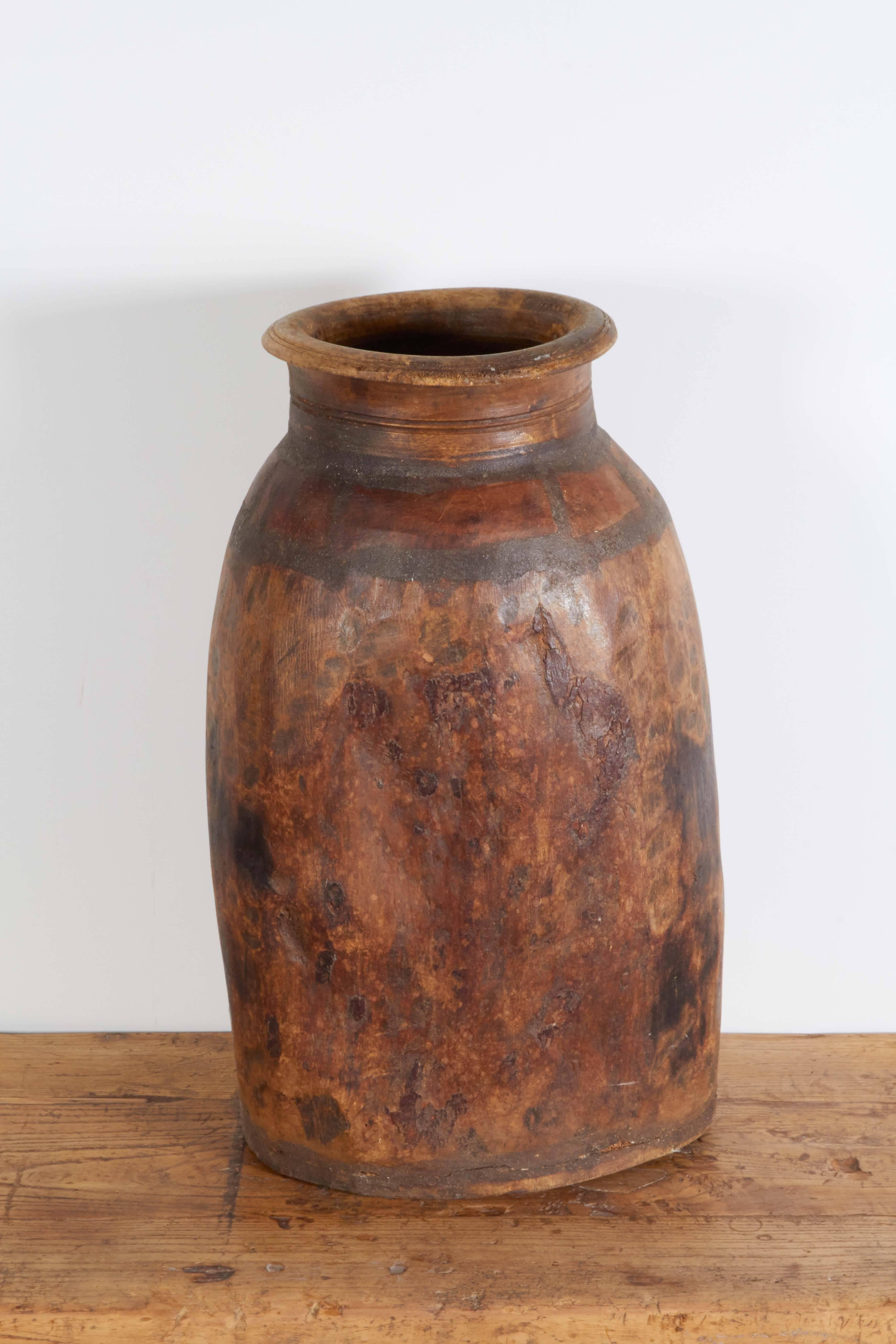 An unusual antique wooden grain container with a Classic, graceful shape and remarkable, beautiful patina throughout. This piece gives a real sense of place, period and history. From Thailand, circa 1900.
M939.