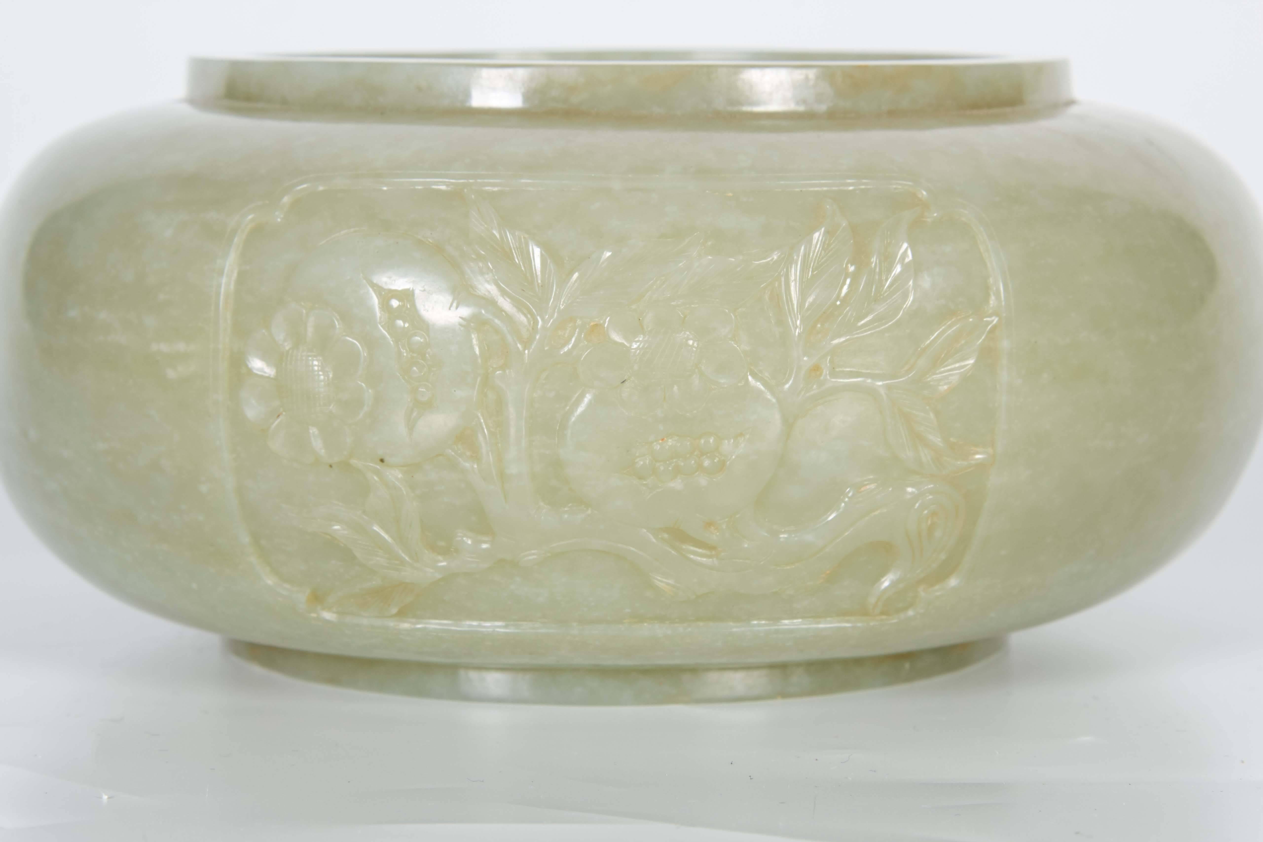 A quite rare 18-19th century Chinese hand carved globular shape alms jade bowl, hand carved with relief panels of sacred fruit. With a beautiful celadon color, this jade bowl has been beautifully hand carved with exceptional craftsmanship. Each side