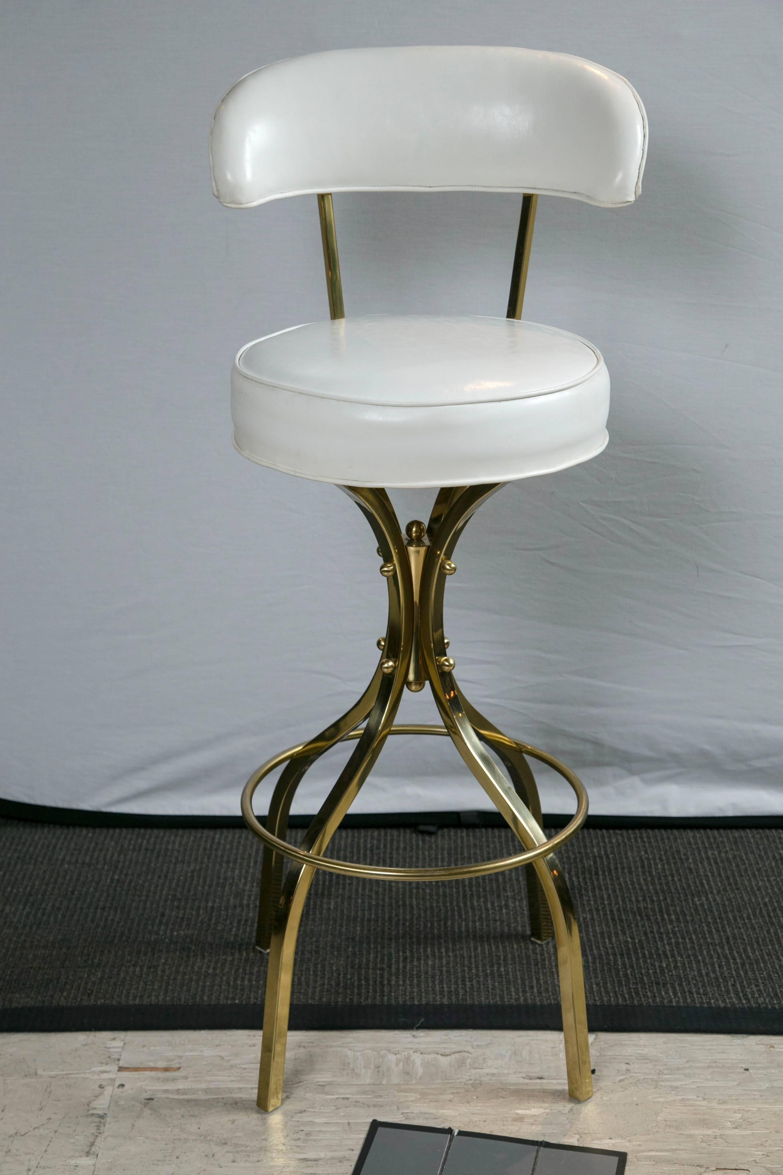 Gorge Kovac brass white vinyl upholstered bar stool.
   