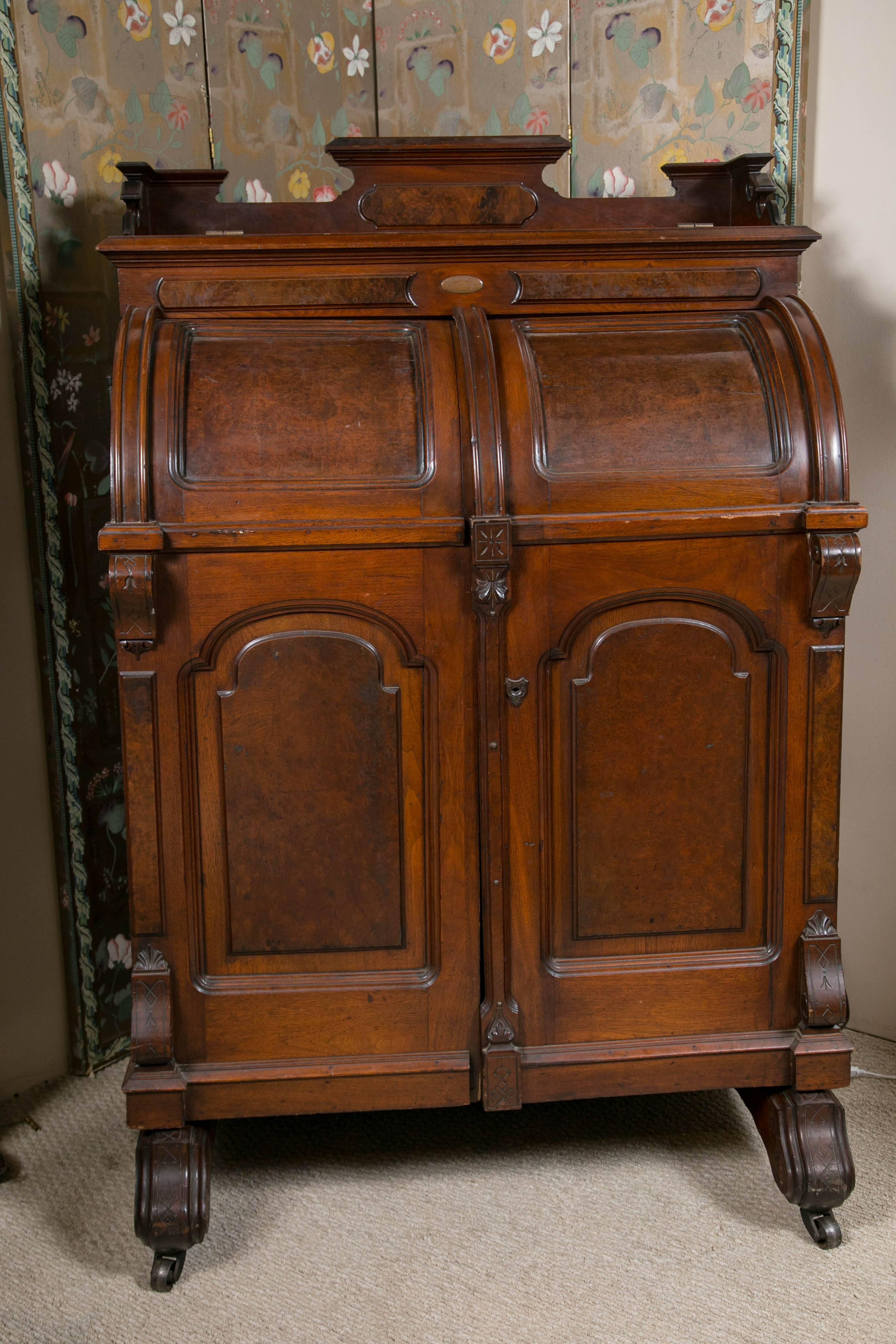 Very rare carved walnut wooten desk with hidden compartments and sections.