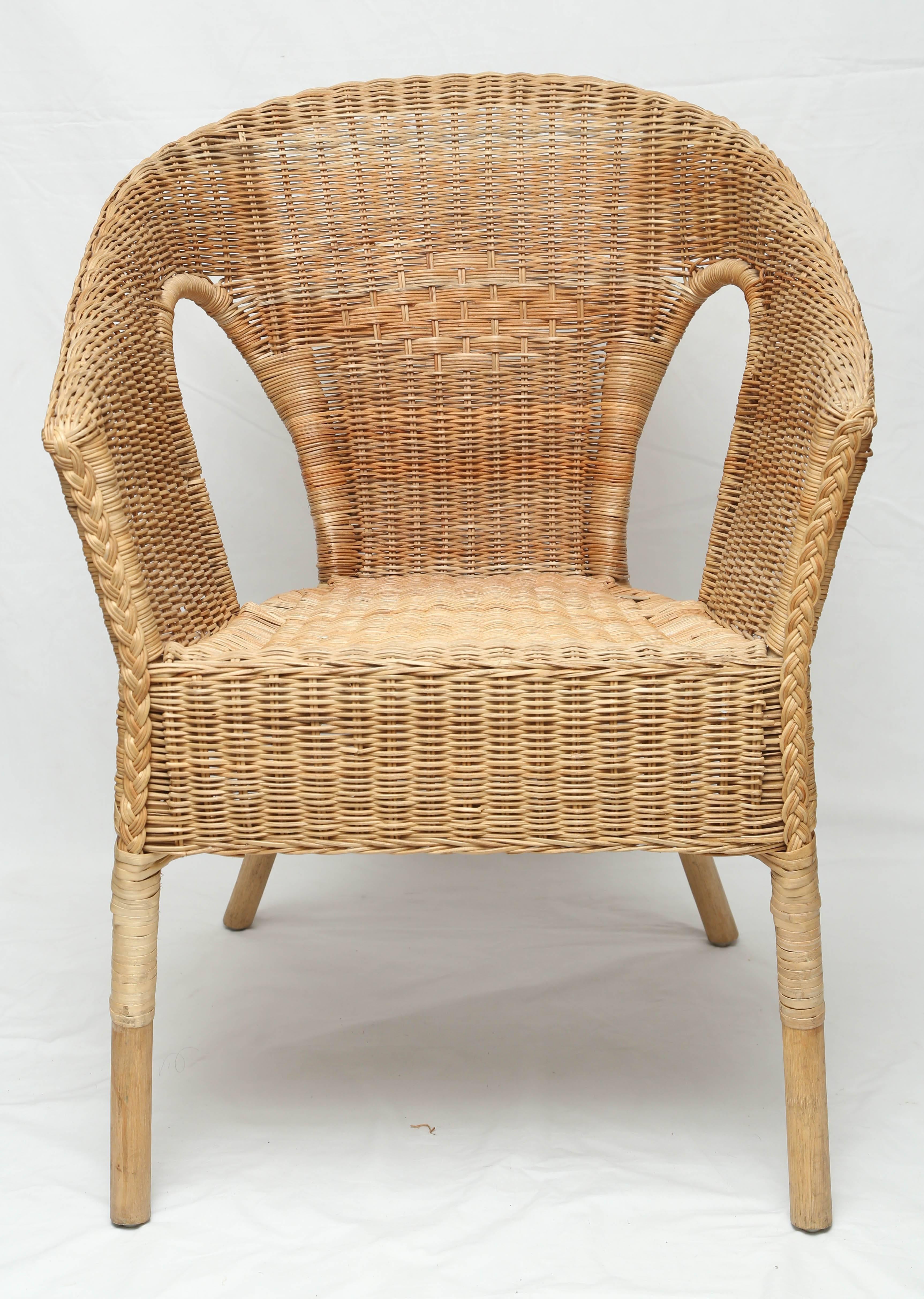 Very unusual pair of French vintage rattan chairs.