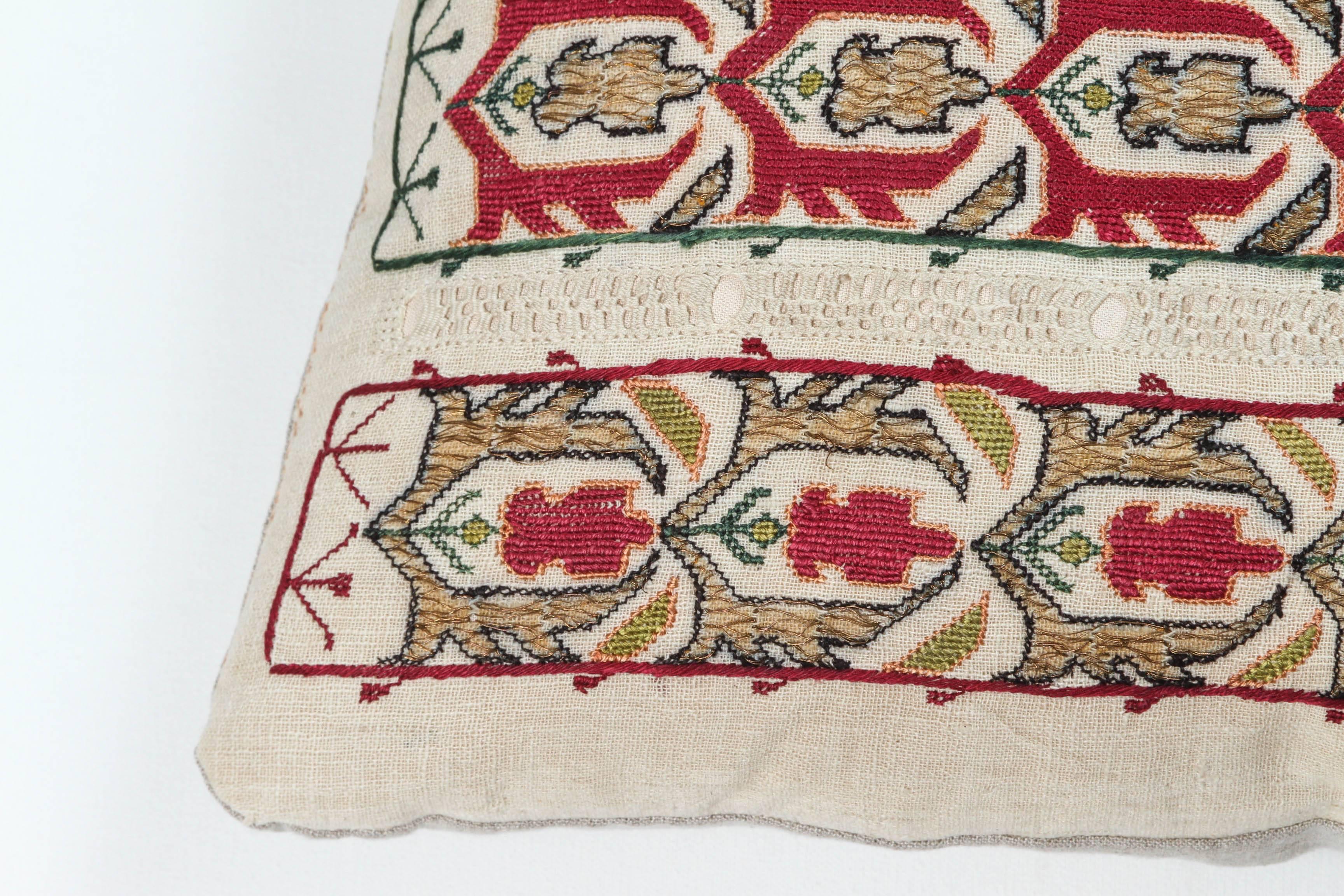 Early 20th century Greek Island (Ottoman Empire) embroidered linen pillow or cushion with silk and metallic gold threads. Pull work on the linen. Crimson red, gold, green, lime green and natural linen color. Natural linen backing, invisible zipper,