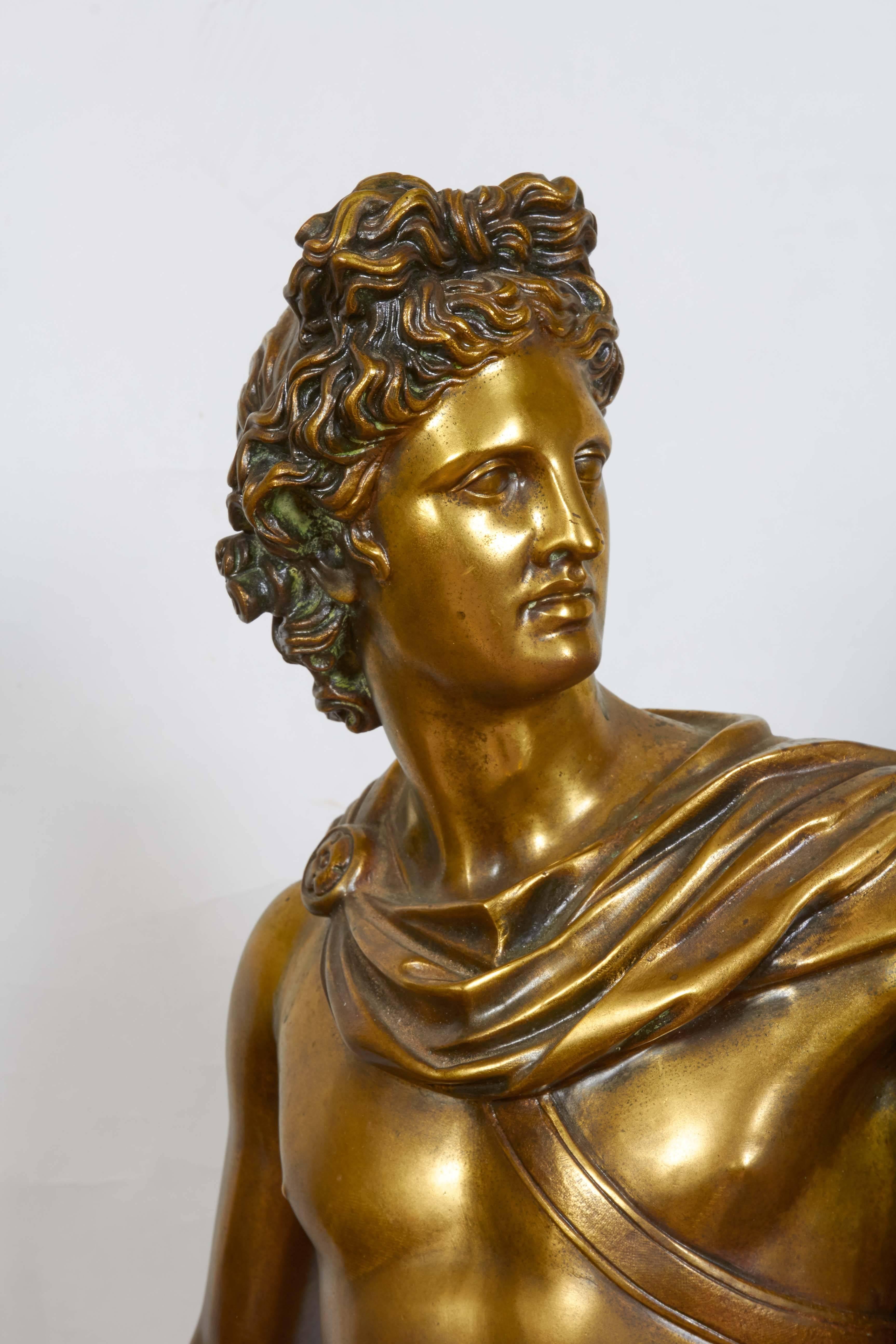 A Roman replica sculpture of the Apollo Belvedere, standing contrapposto on a circular base.