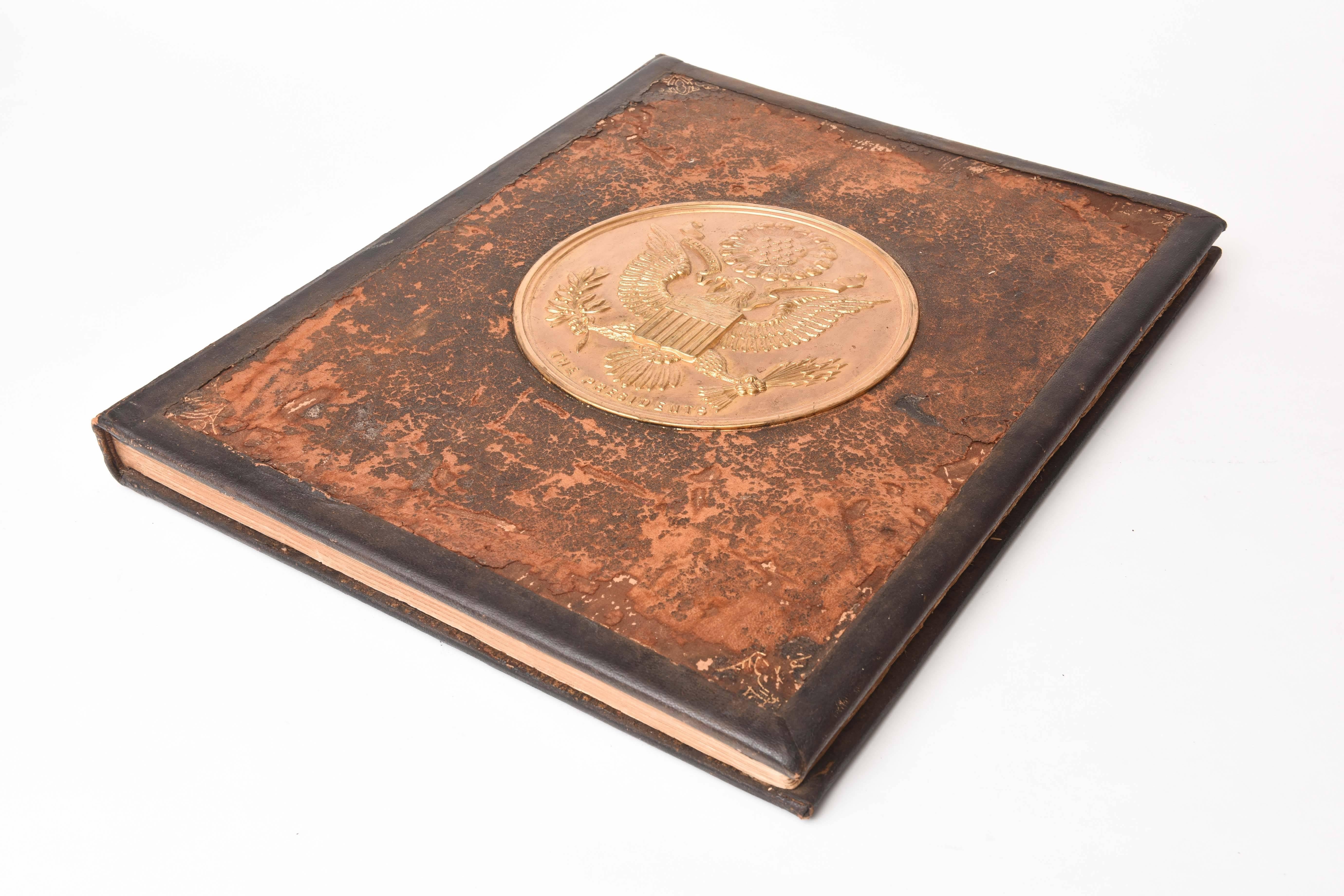 An interesting and rare antique book of Presidential portraits from Washington to McKinley. A limited edition and numbered # 2212. A great heavy and gold-plated official Presidential Seal Medallion on the cover of this special book. Tooled leather