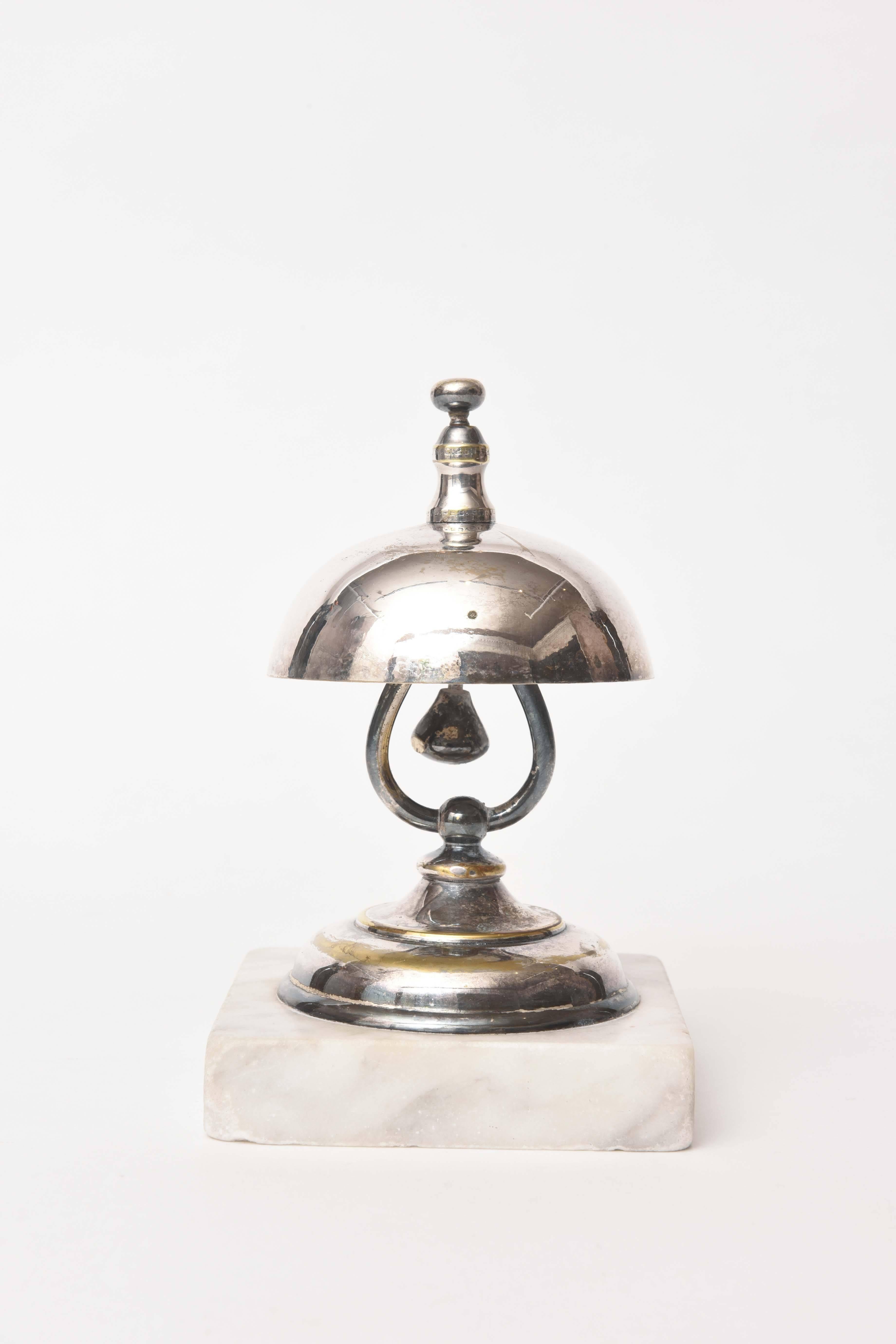 Cute as a button and in fine working order. Silver plate and a hallmark we had trouble reading. Great quality and good condition.