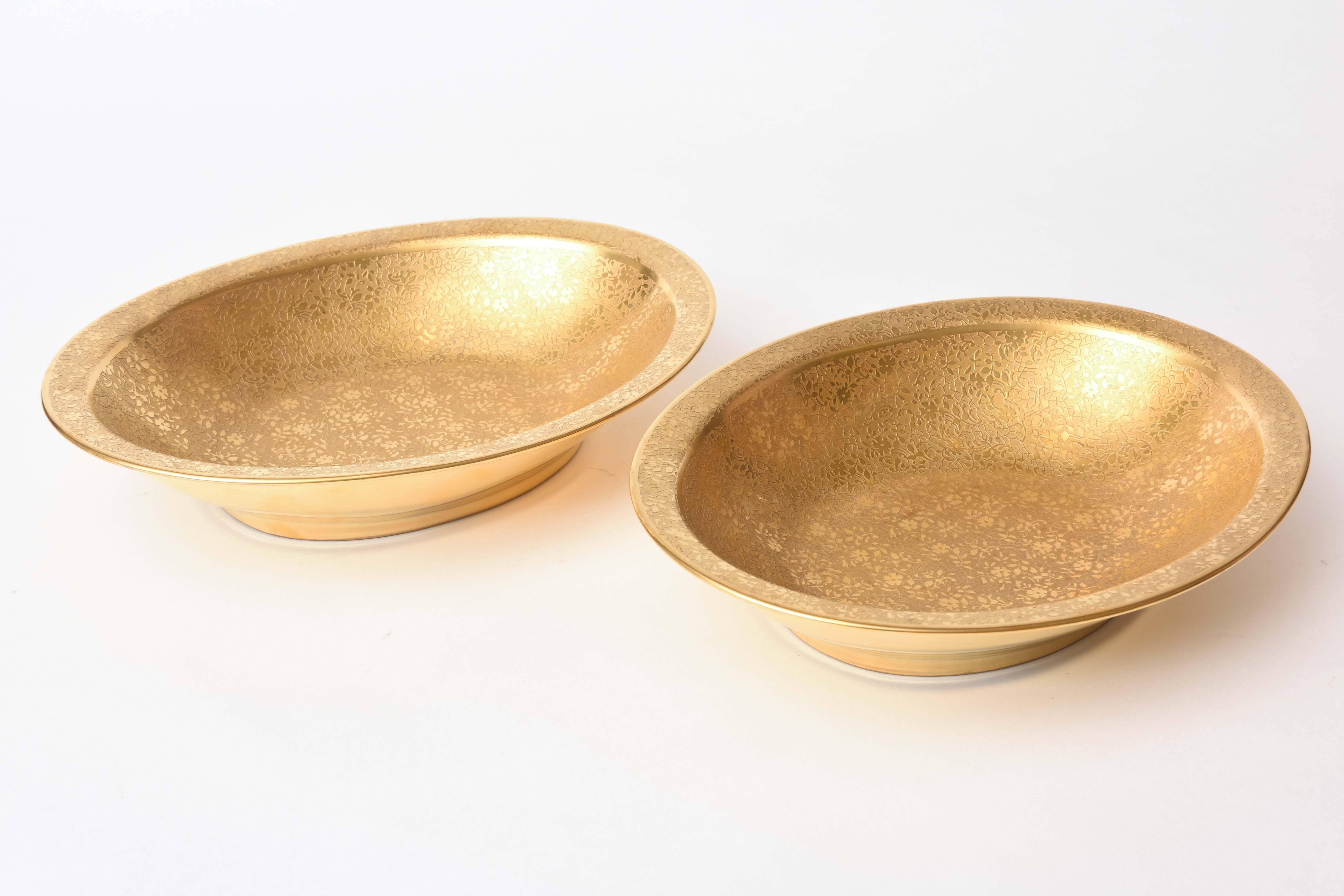 A pair of 24-karat acid etched gold on porcelain serving bowls. Antique and in wonderful condition. Perfect to use for your holiday table or simply stunning for display.