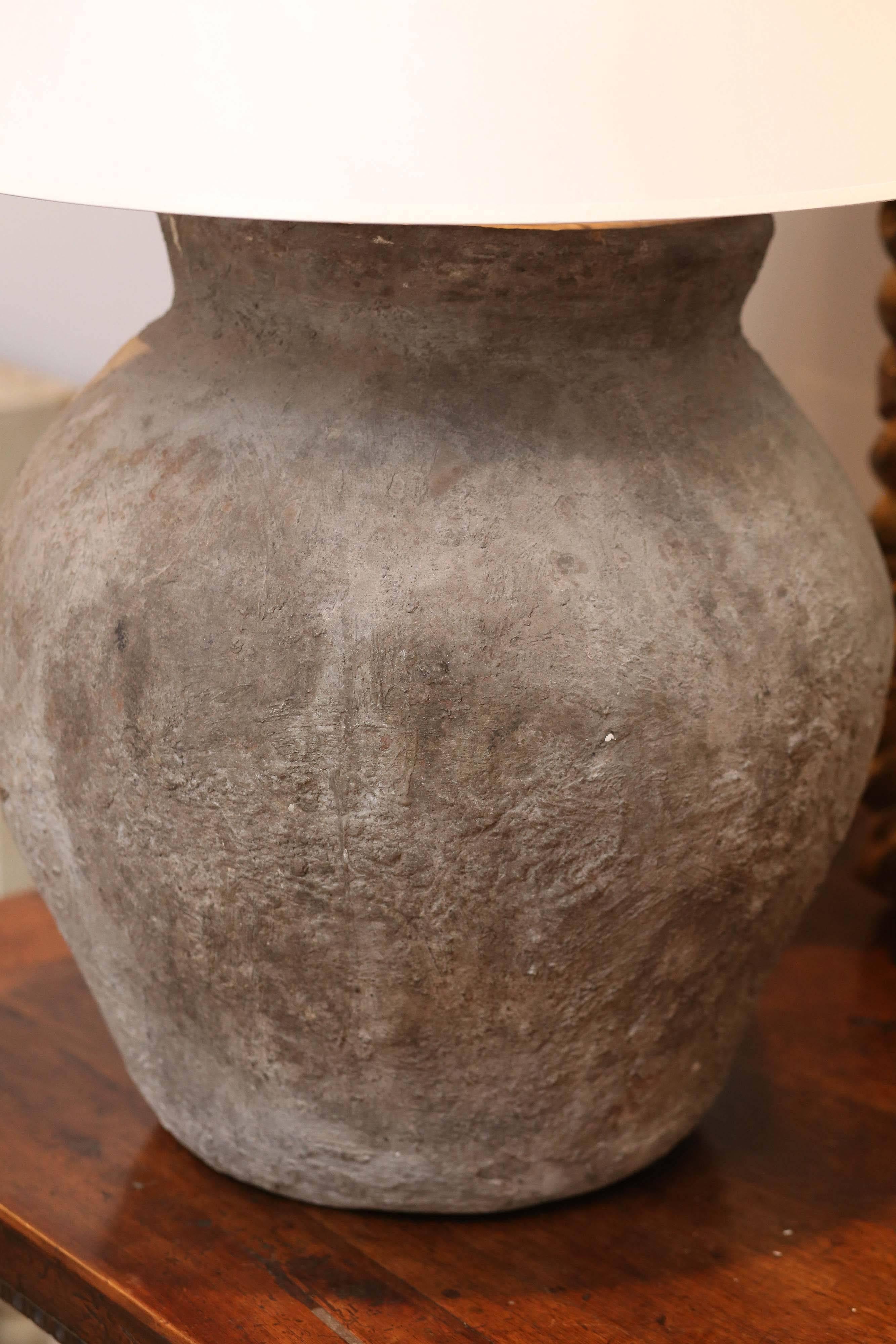 This Asian vessel jar has a great grayed lavender to the terra cotta. It has been newly made into a lamp and requires an 18