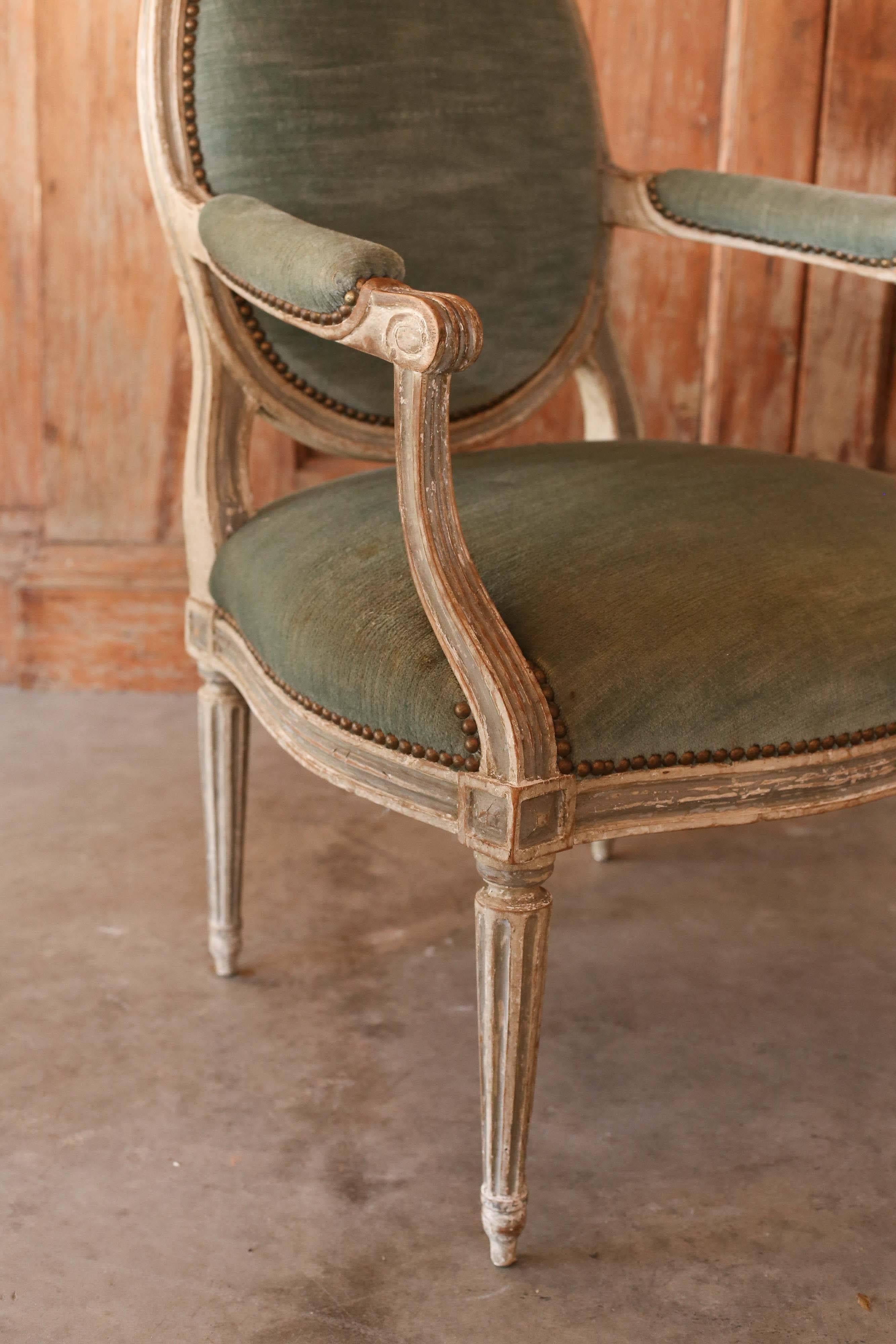 French 18th century Louis XVI painted armchairs with velvet upholstery stamped by N Blanchard.