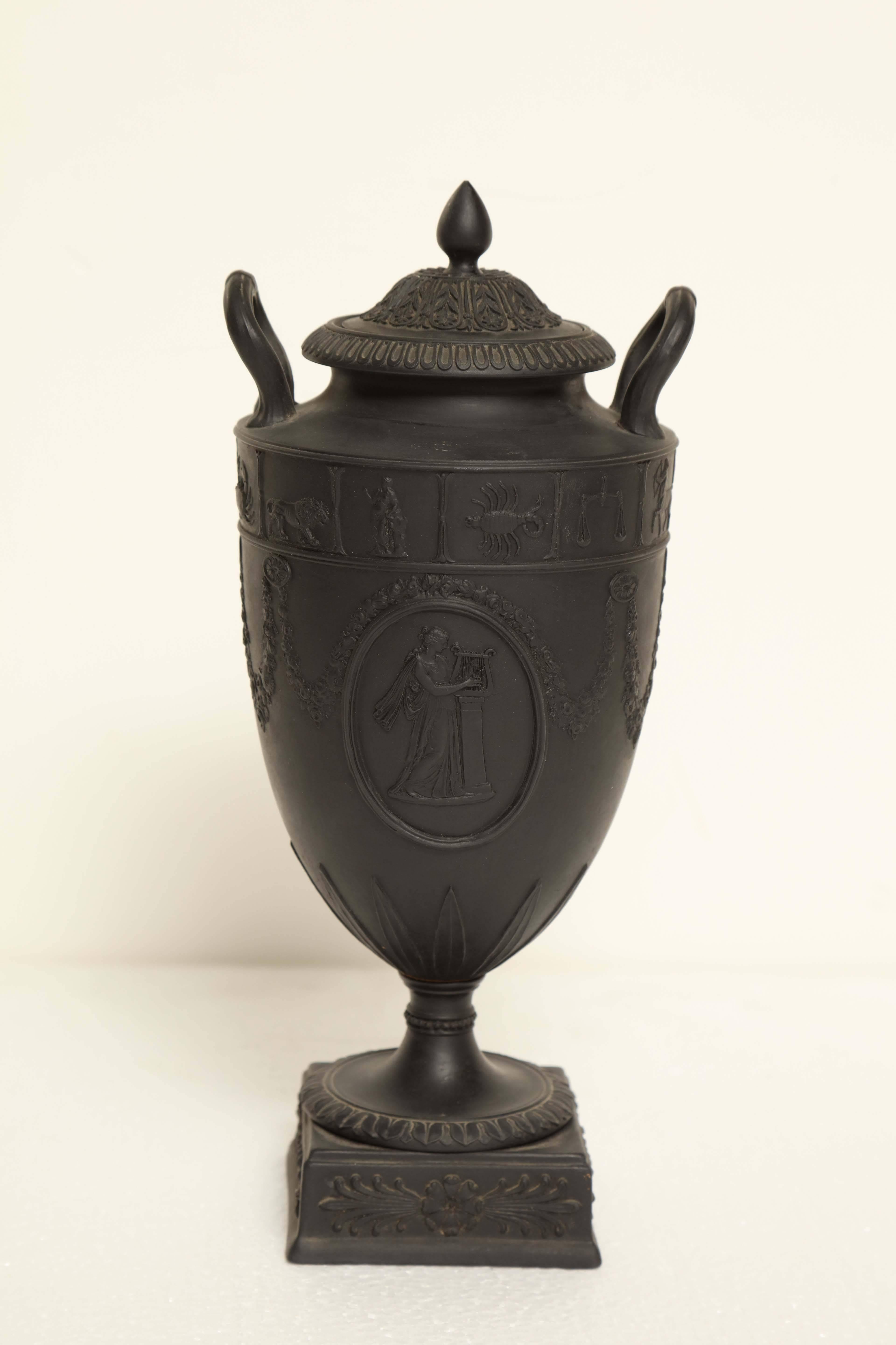 Early 19th century Wedgwood black basalt urn with lid.