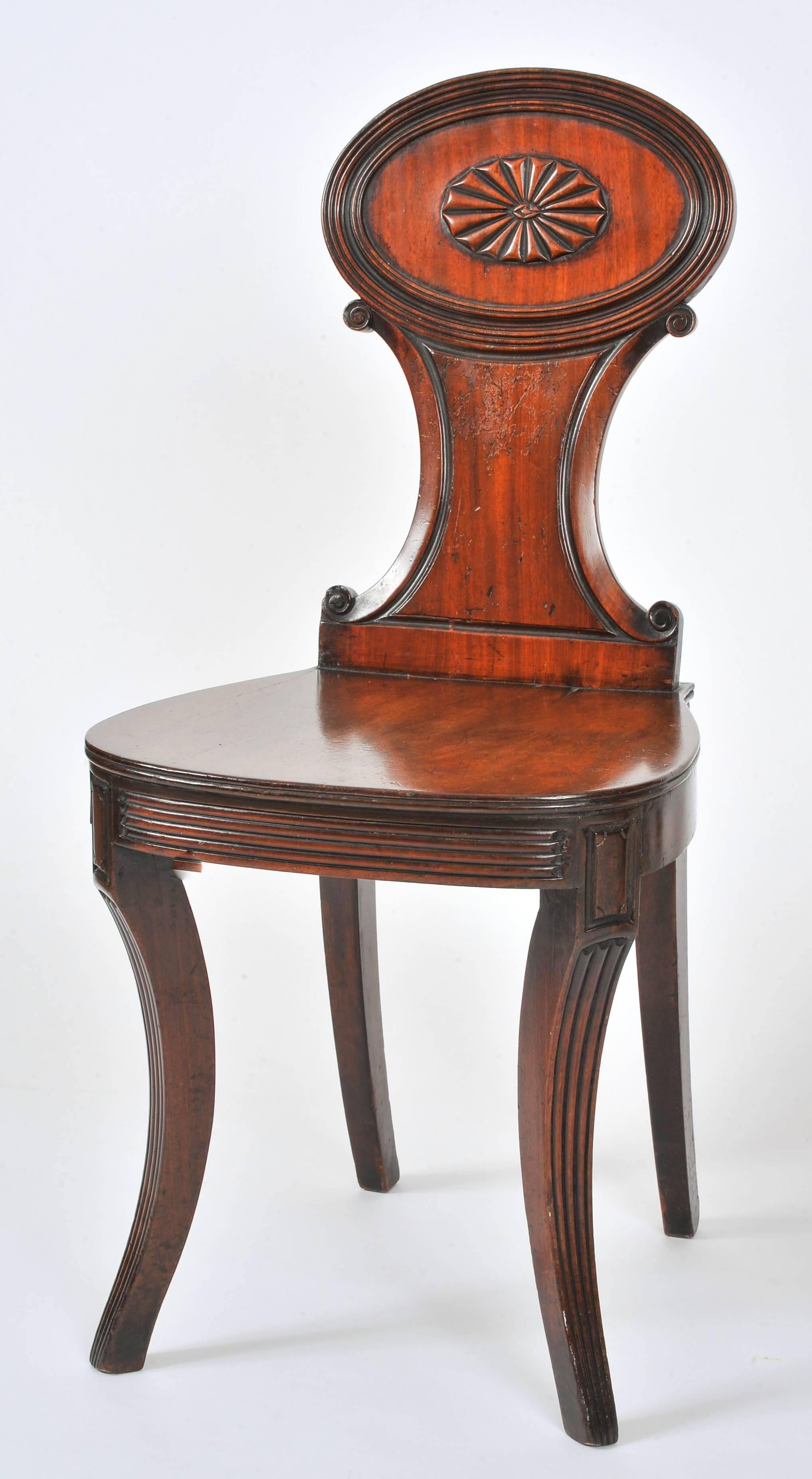 English Pair of Regency Carved Mahogany Hall Chairs