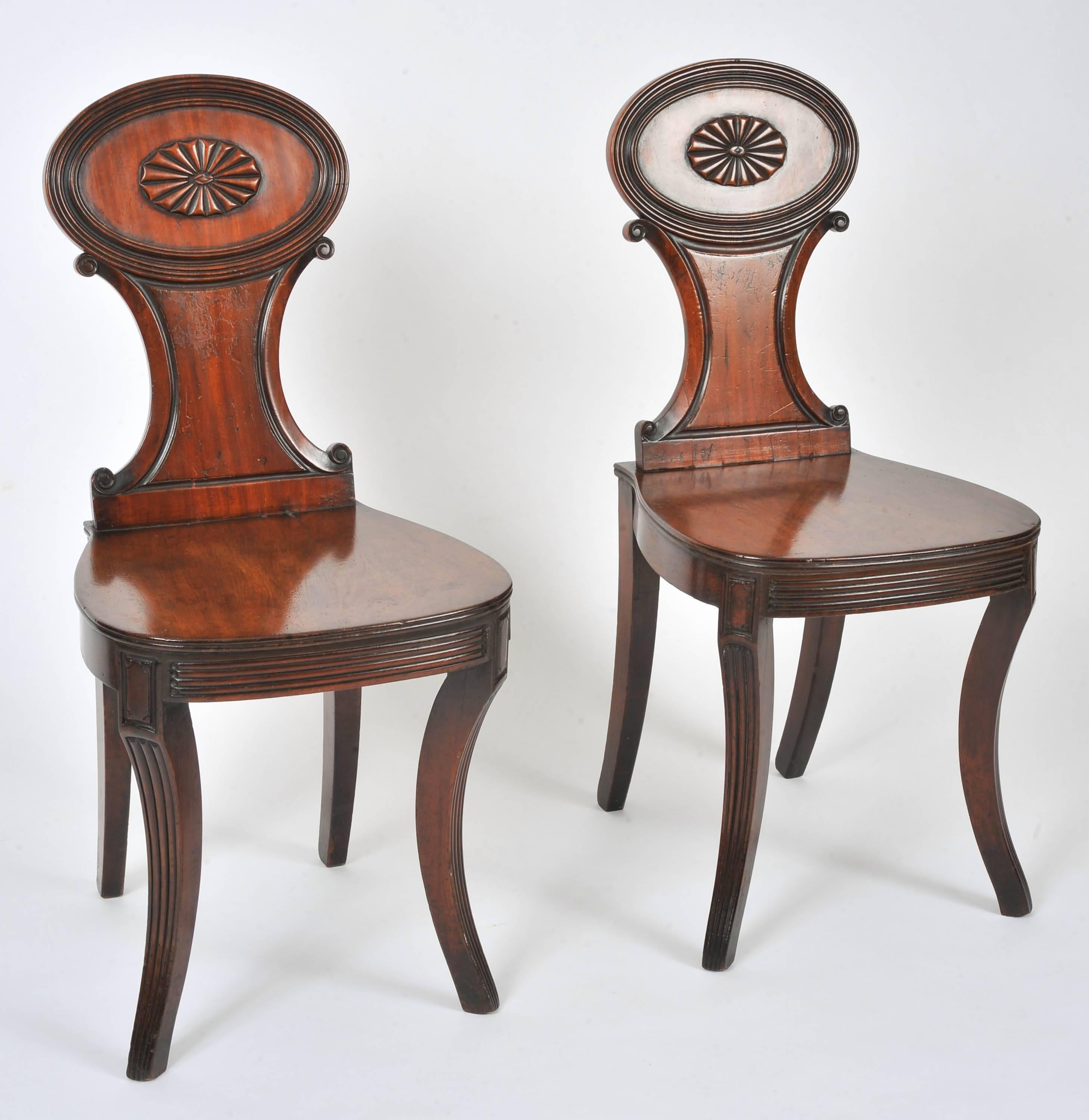 Pair of Regency Carved Mahogany Hall Chairs In Excellent Condition In London, GB