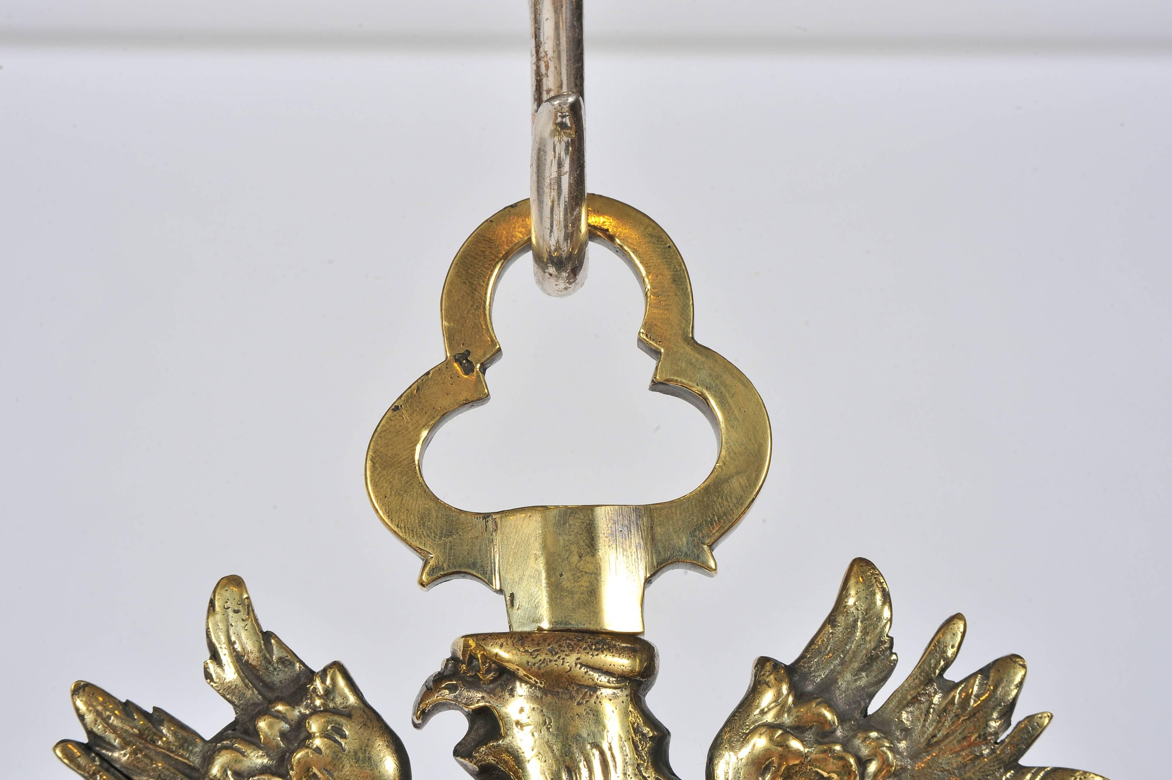 Pair of Mid-19th Century Eight-Branch Brass Chandeliers, possibly Austrian. 8