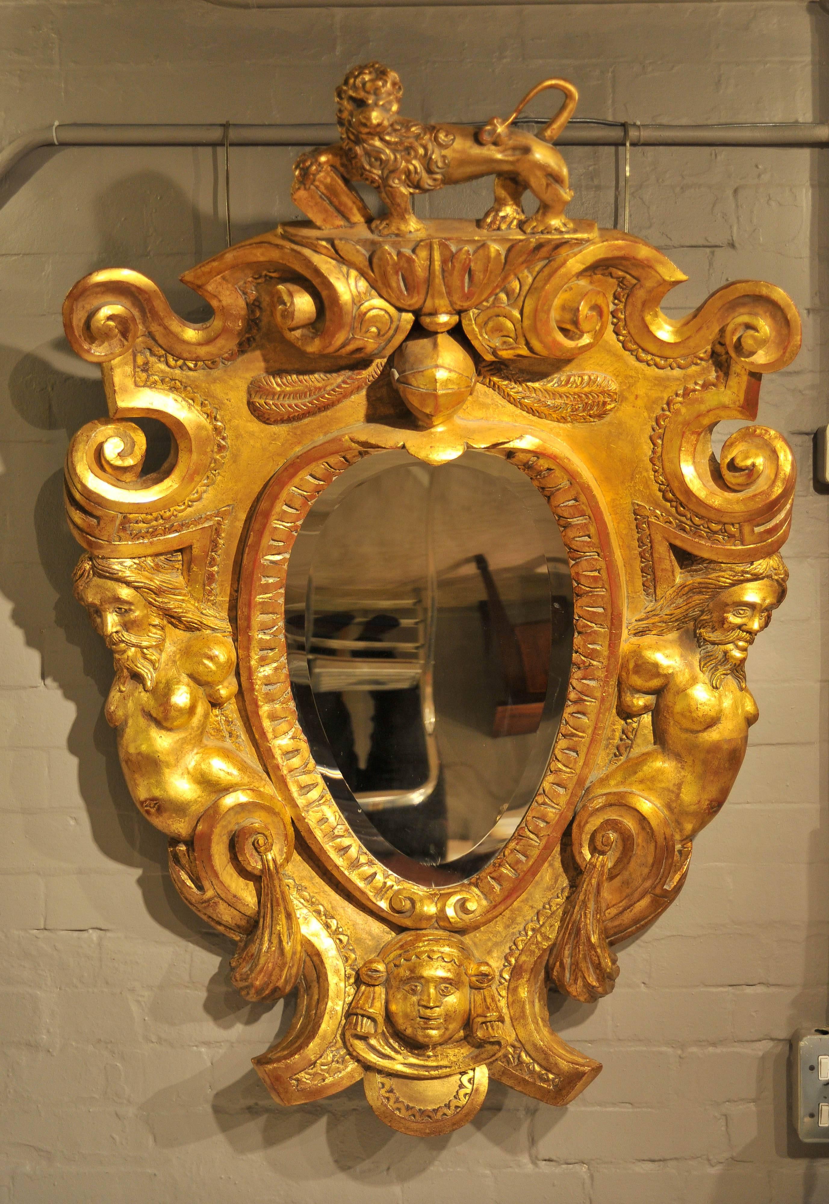 A majestic Baroque period Italian carved wood frame with curved mirror plate.
Most likely to have be designed and made to contain an heraldic coat of arms.
The 