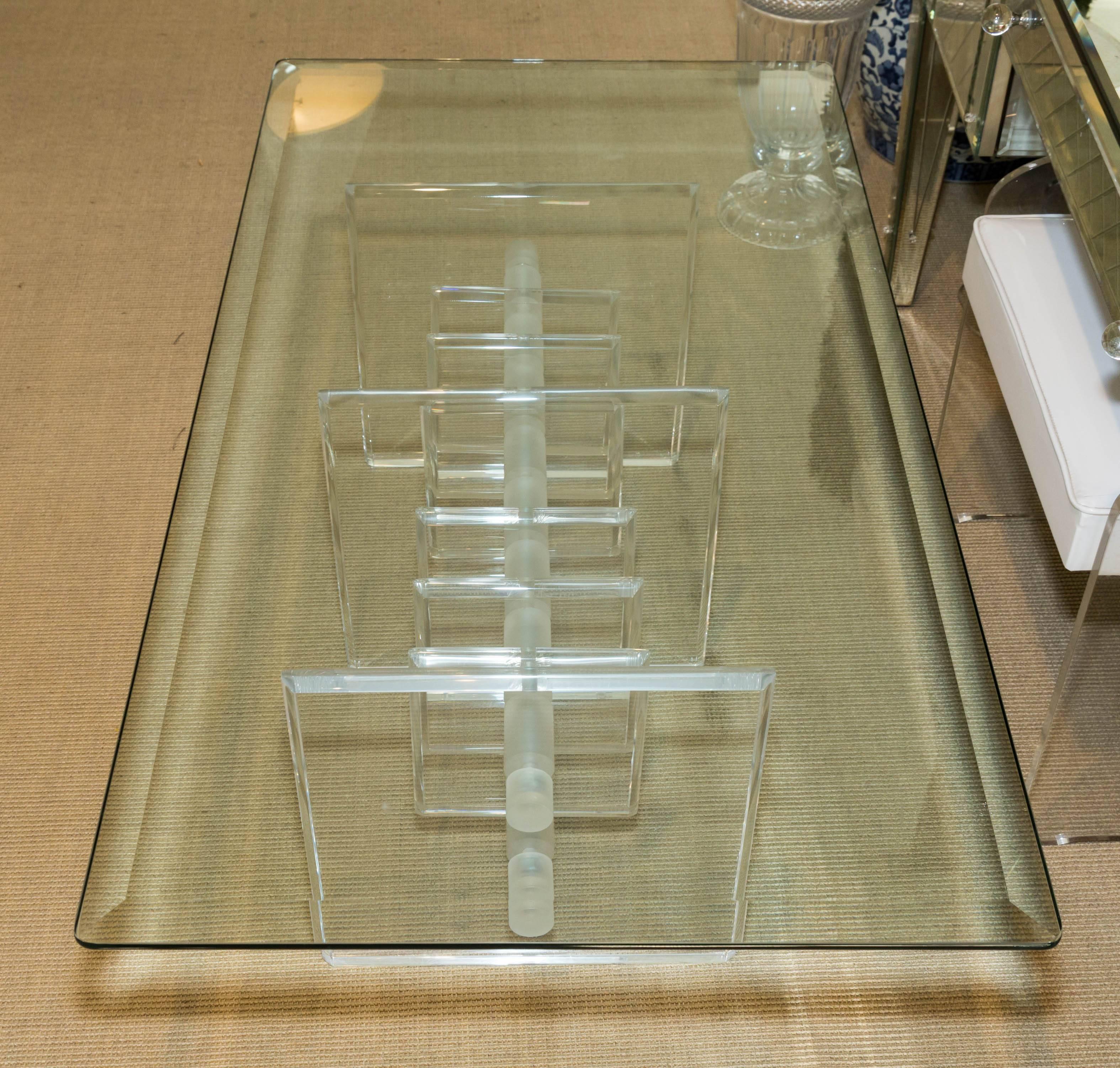 Mid-Century cocktail table with beveled glass top and attractive Lucite base.