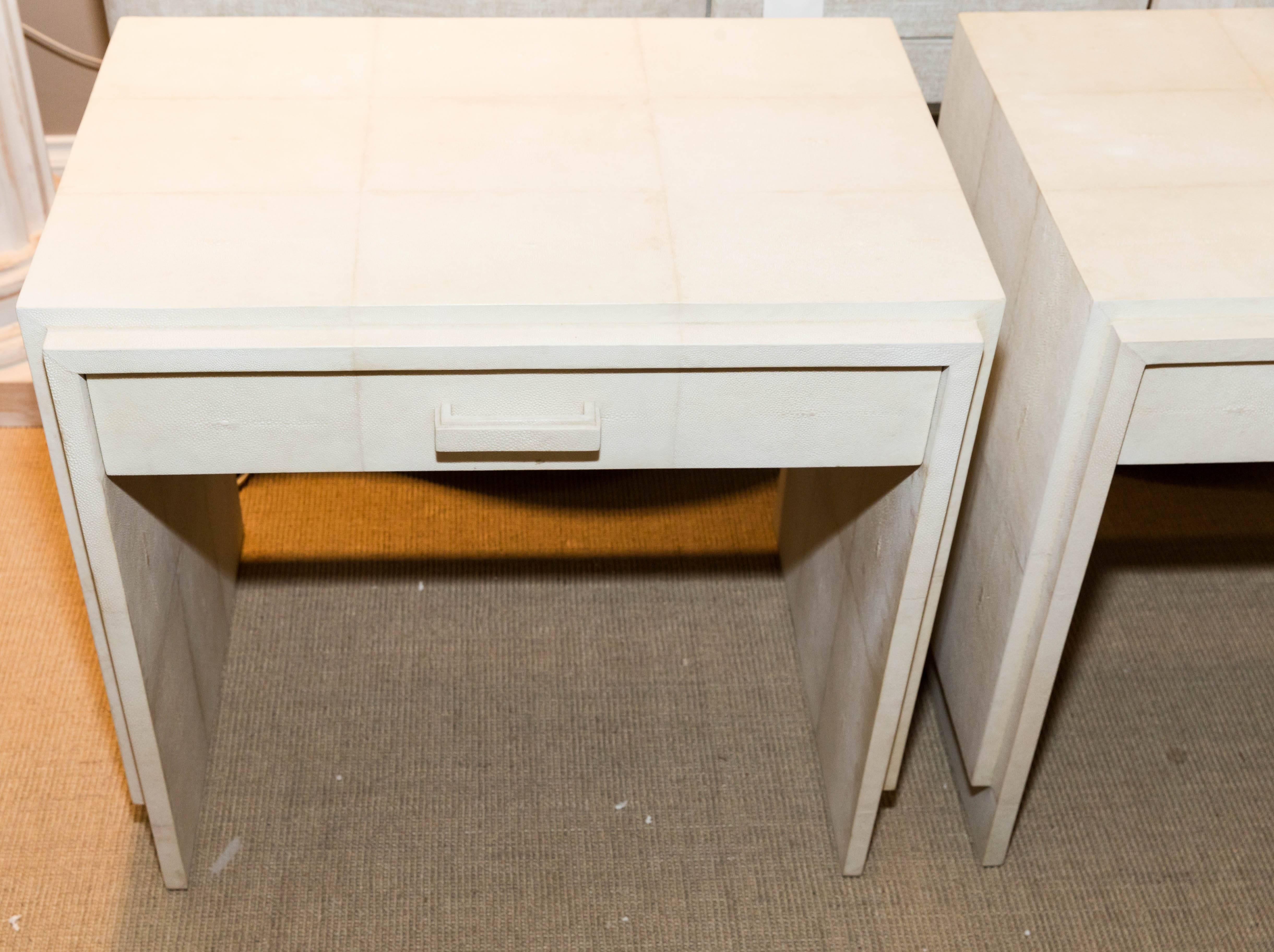 Attractive pair of white Shagreen one drawer nightstands.