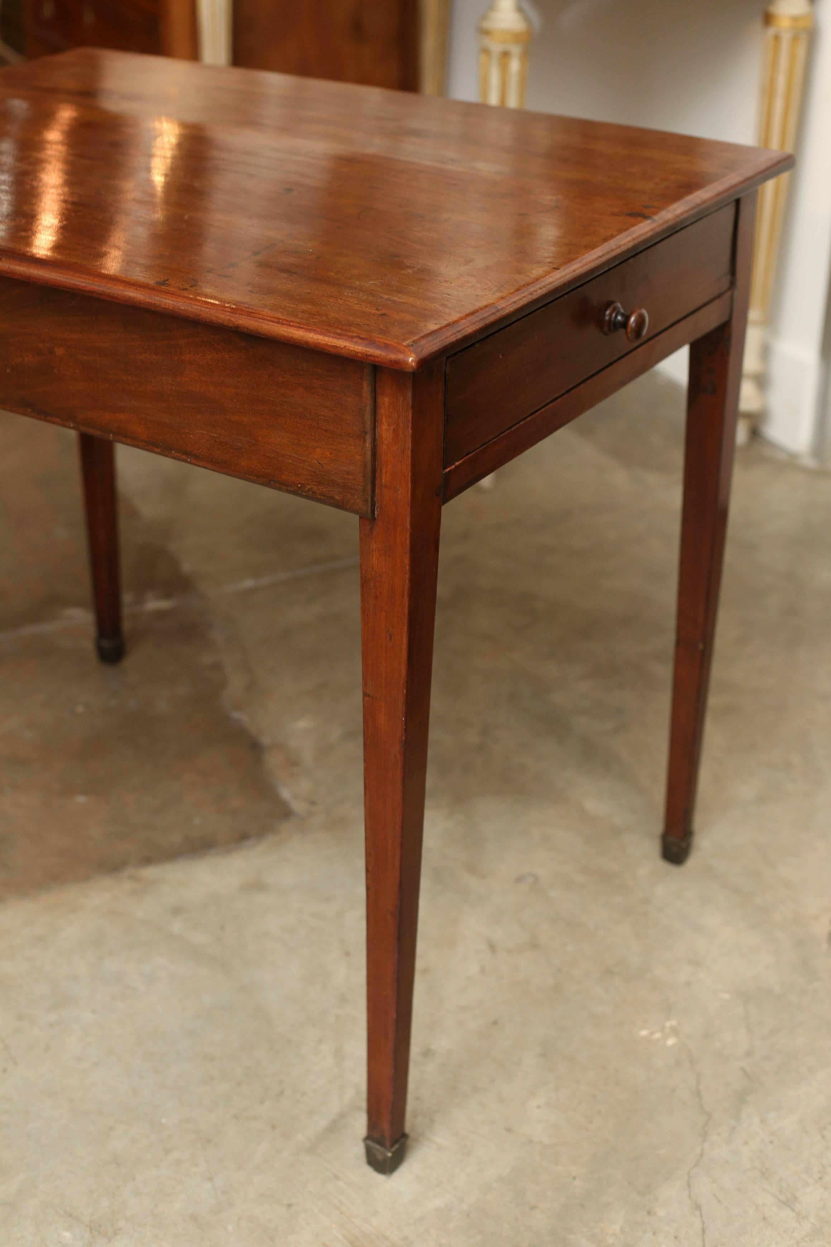 19th century English end table with a single drawer. Beautifully tapered legs with metal end caps. Spectacular patina. Clean simple lines.