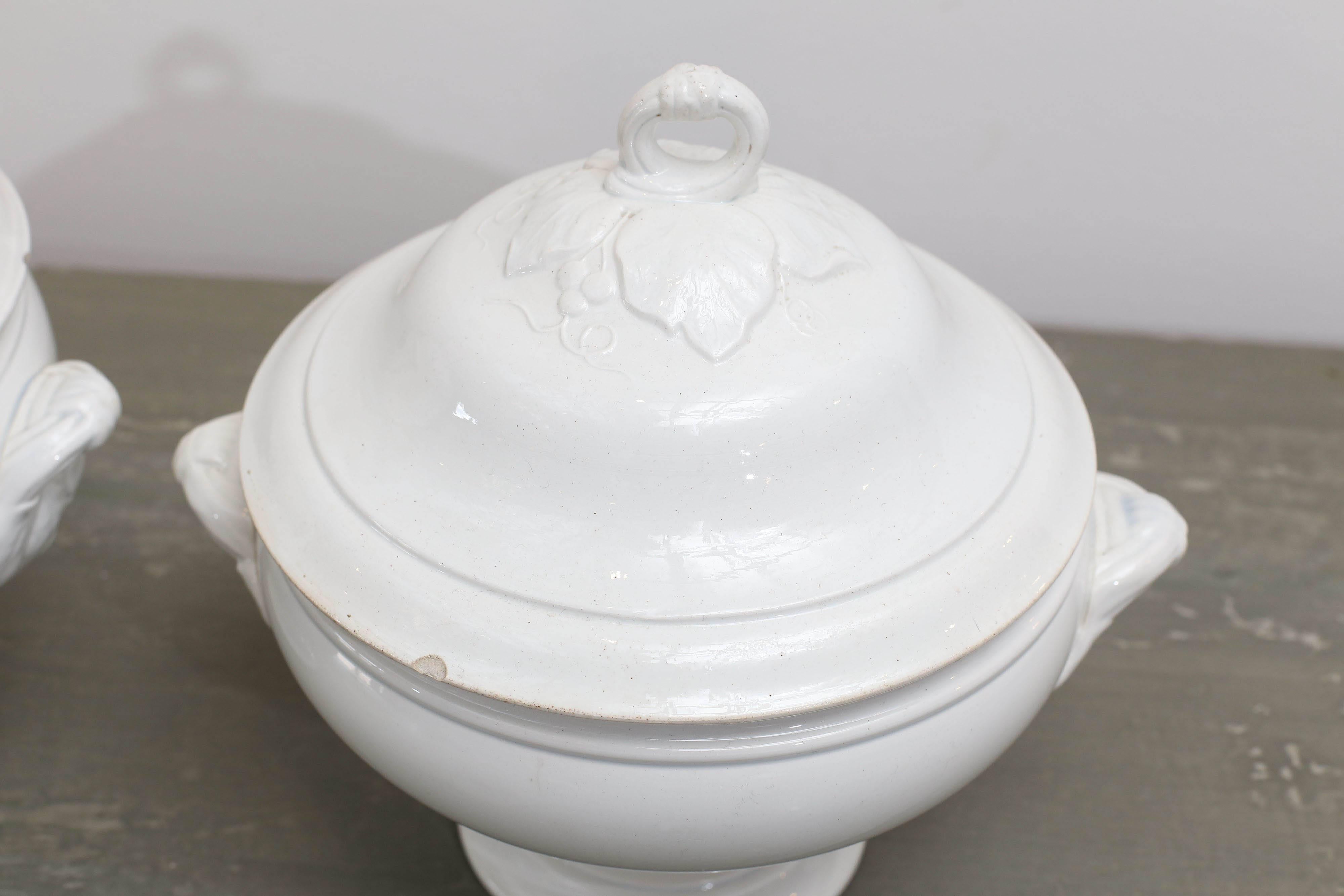 19th century Belgian white soup tureens.  Chips on covers.

Measures: Left tureen: Height 11.5