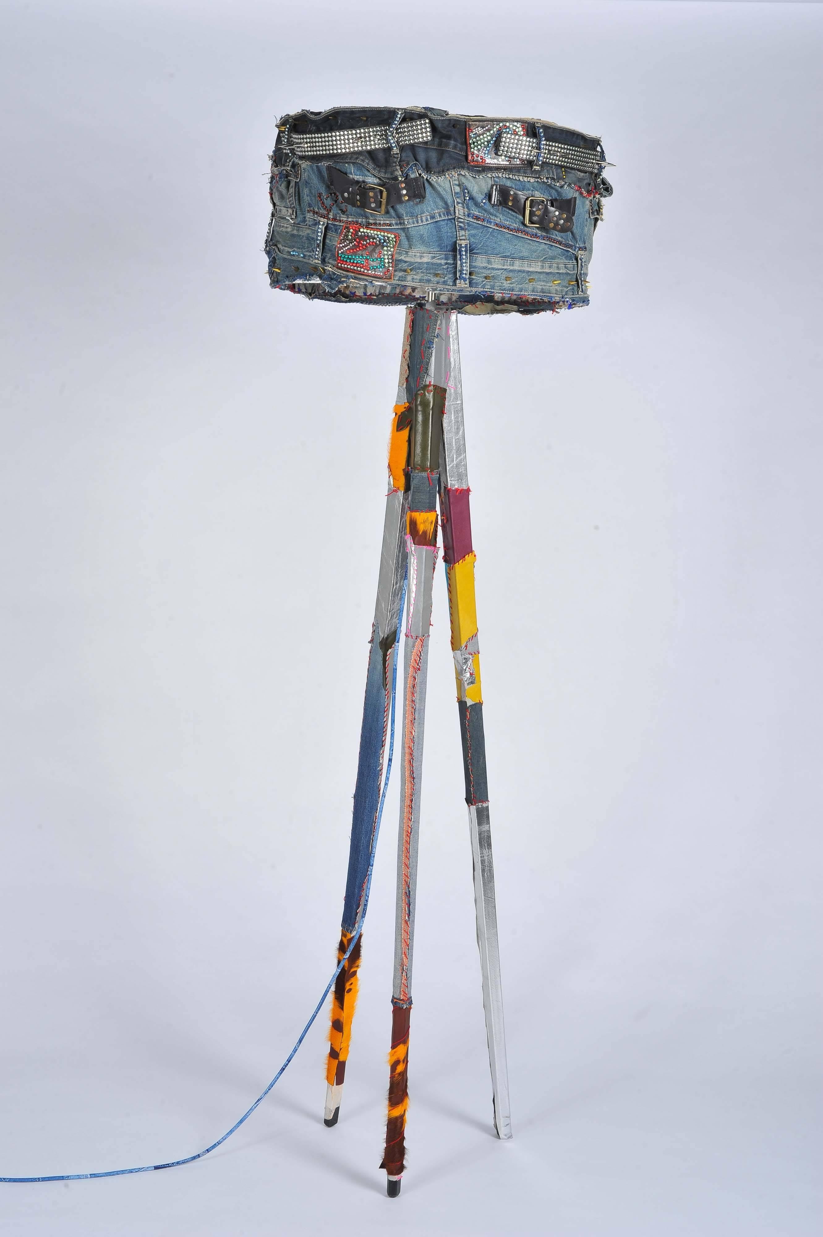A fabulous unique handmade Rock & Roll Bohemian style floor lamp. Made out of 1970s vintage jeans denim, leather, real cow skin and crystals. Also embellished with hand-embroidery.

Made by Joelle Talmasse.