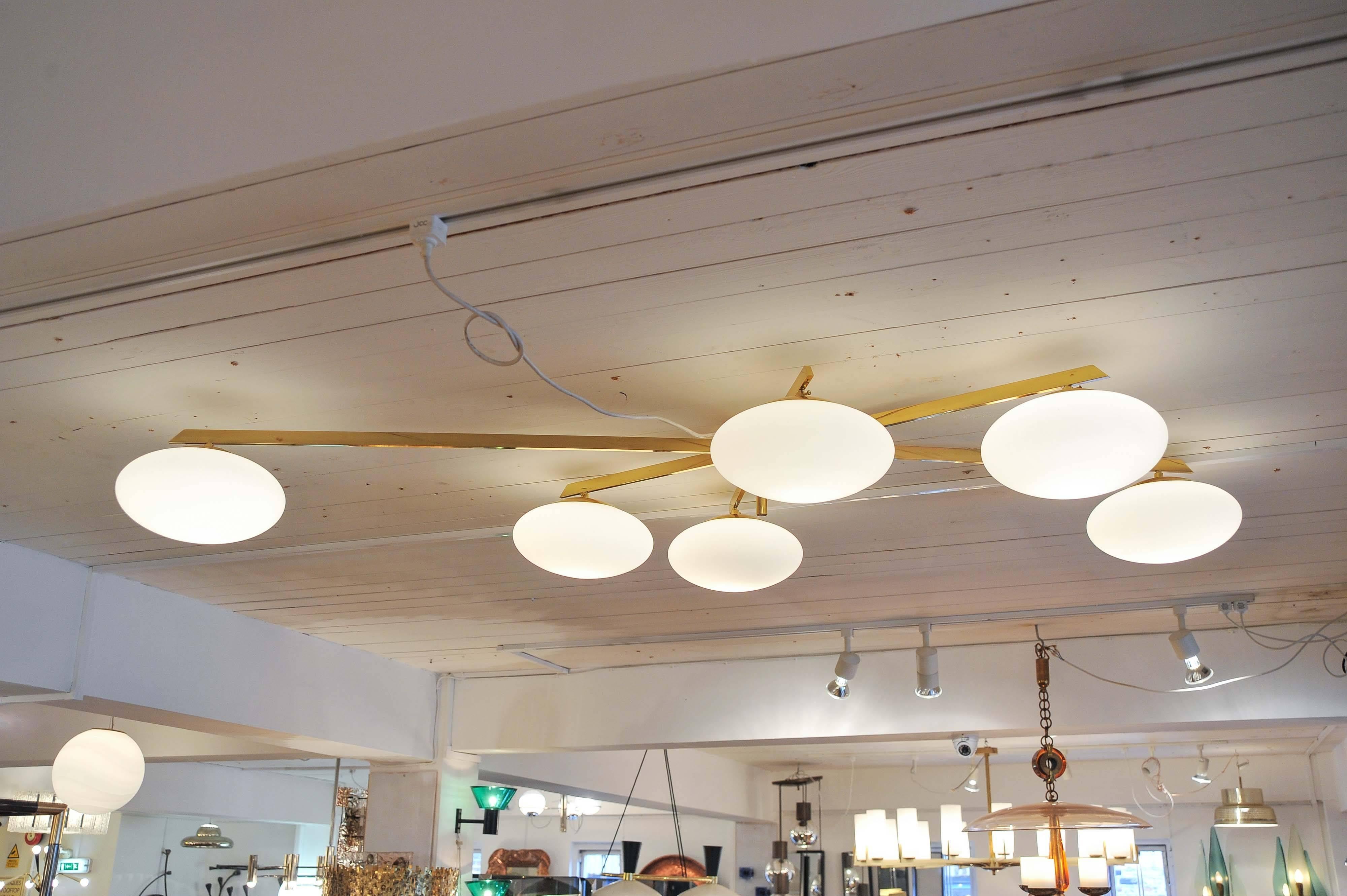 Brass and opaline shade flush mount ceiling light

style of Angelo Lelli for Arredoluce.