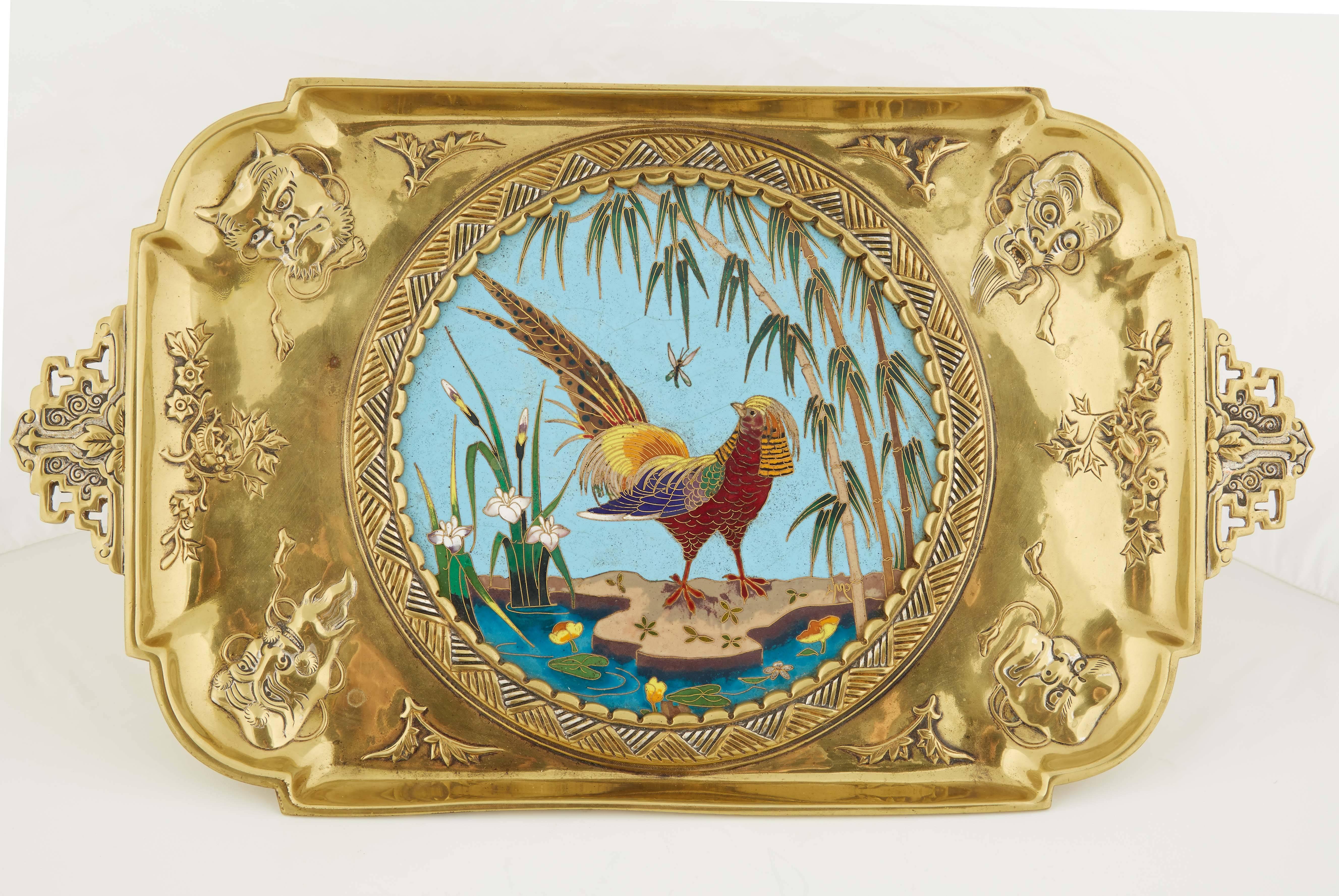 A rare French Japonisme ormolu and Cloisonné enamel tray by Edouard Lievre.

The enamel medallion depicting a pheasant in a garden.

Signed HMP.

Very finely cast with masks and silver highlights.