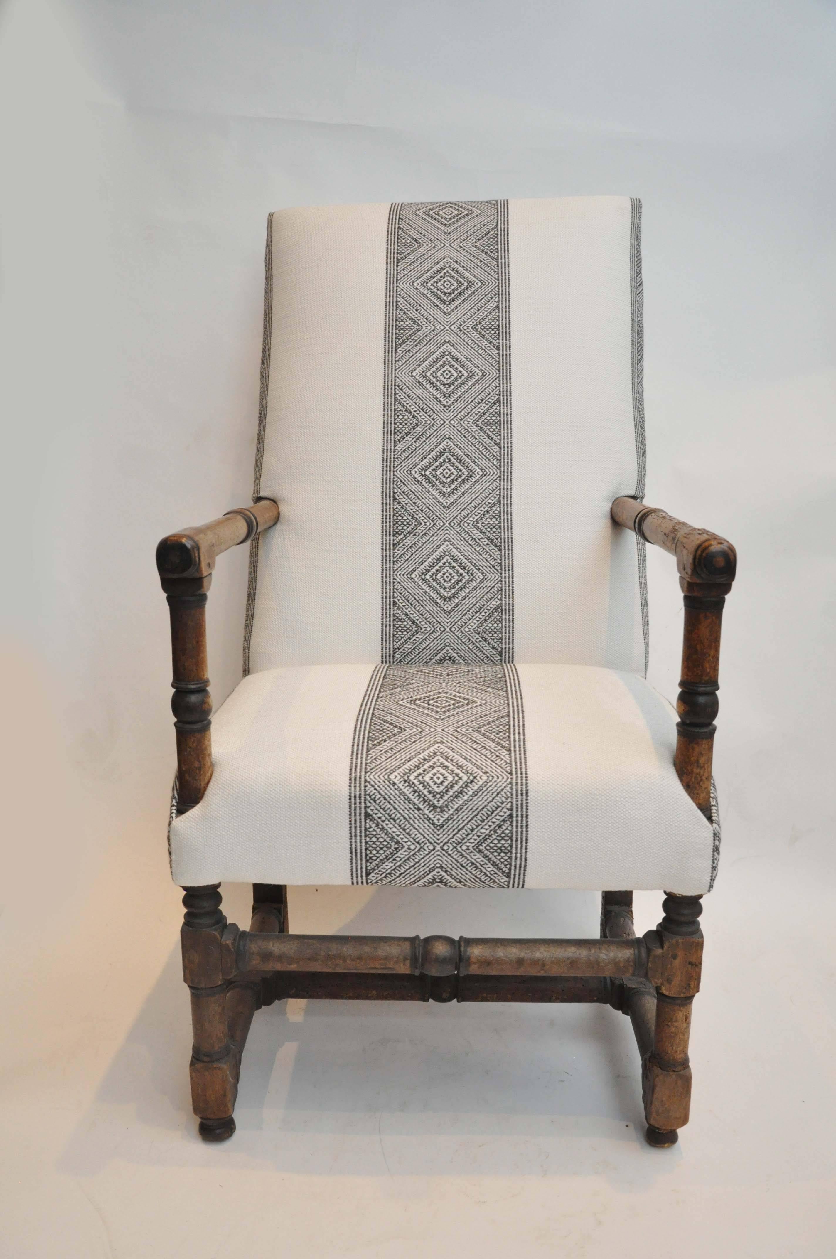 17th Century Classic French Armchair, gently restored without glue, newly upholstered in Manuel Canavos fabric. 
Beautiful patina on the wood frame. 
Found in south France.

Dimensions: 21.5"W x 28"D x 41.5"H x 17.5"SH x