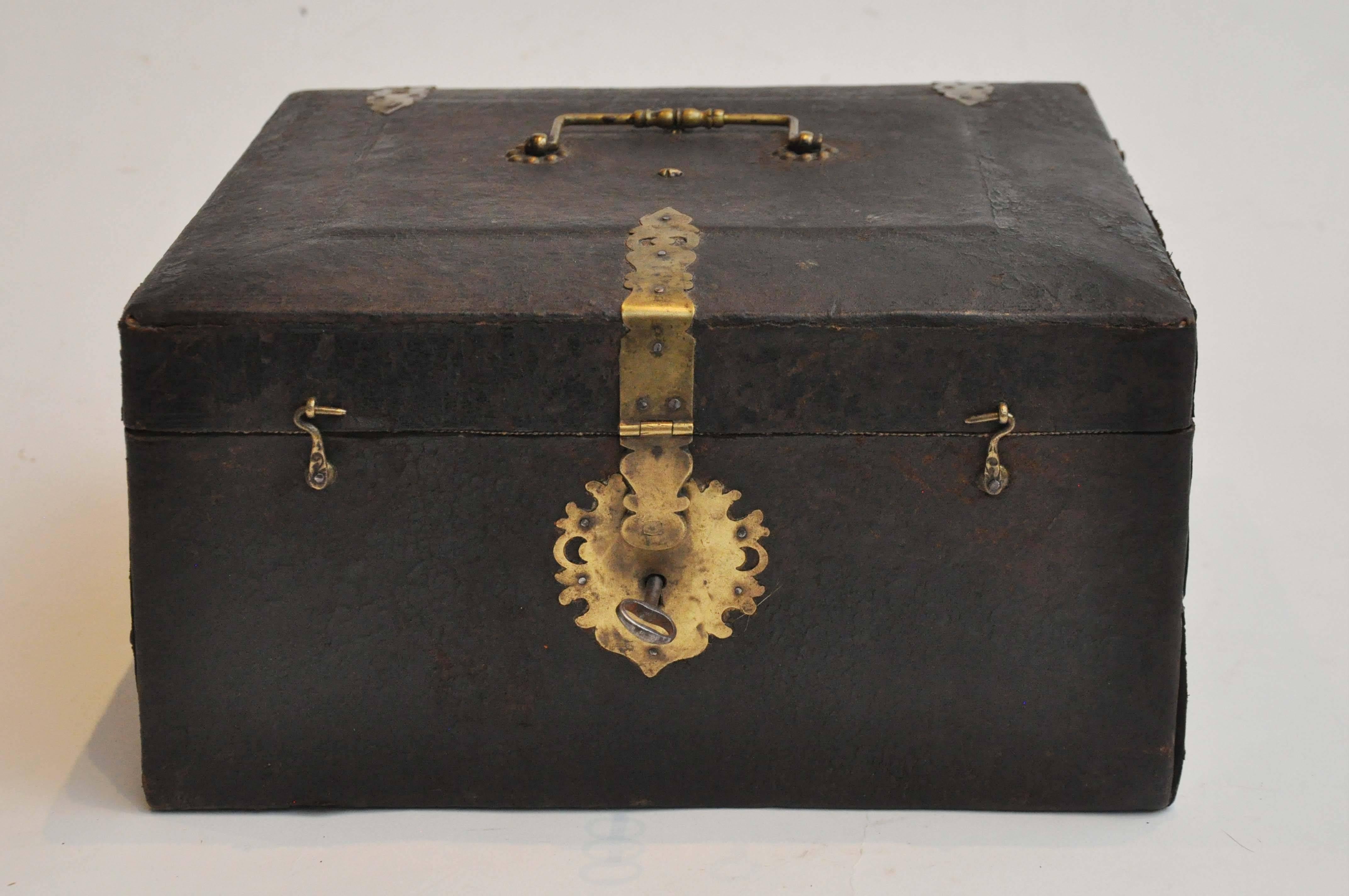 19th Century Leather and Brass Decorative Box from Germany. 
Beautifully constructed of leather exterior and brass details and an upholstered green interior. Was most likely a keepsake or Jewelry Box.
The interior also features a removable tray for