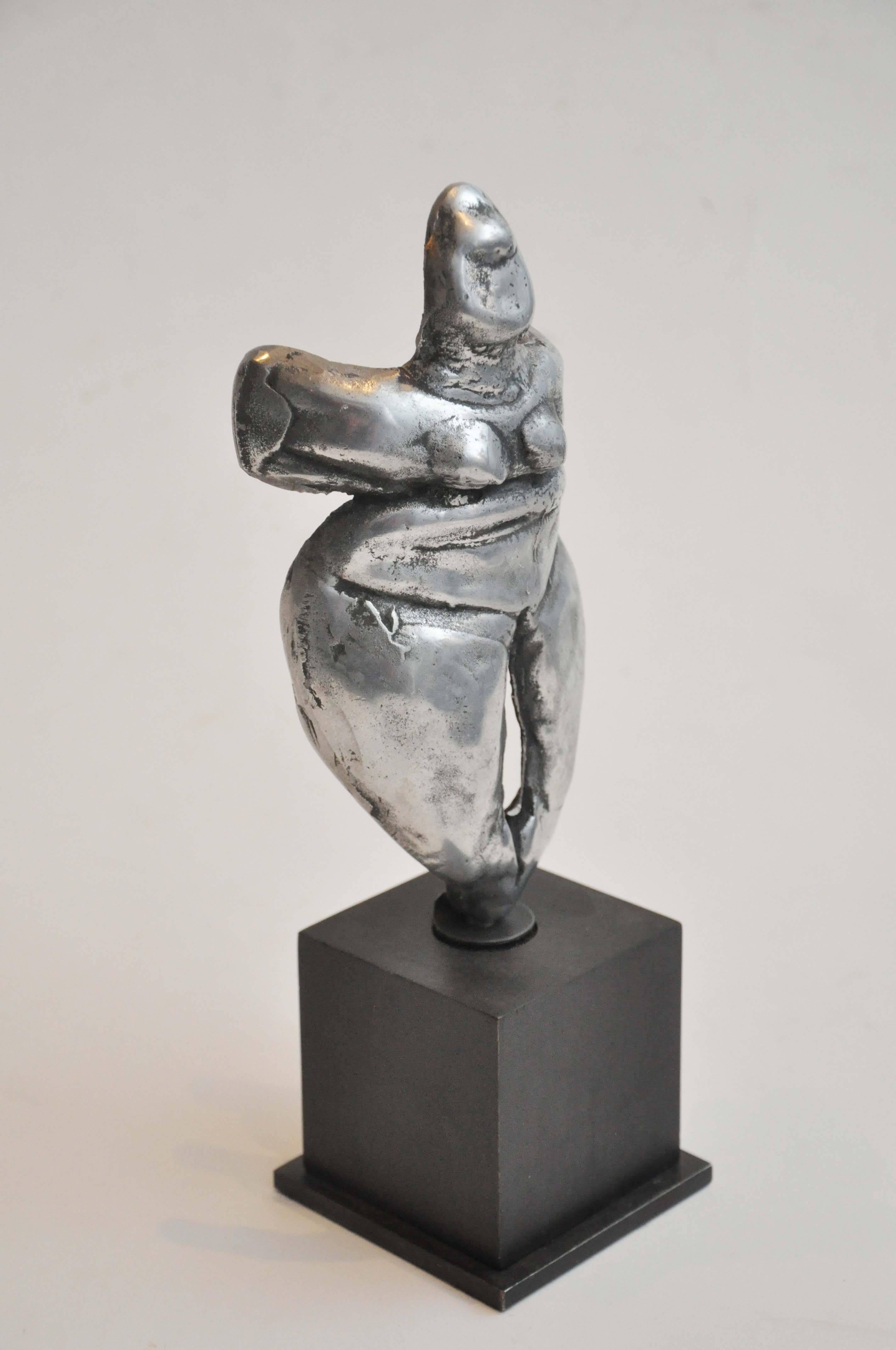 Early 20th Century Small Figural Studio Sculpture in Silver Metal from Uruguay Mounted on black wood stand. This piece is hand made, fun and funky!

Dimensions: 11.5