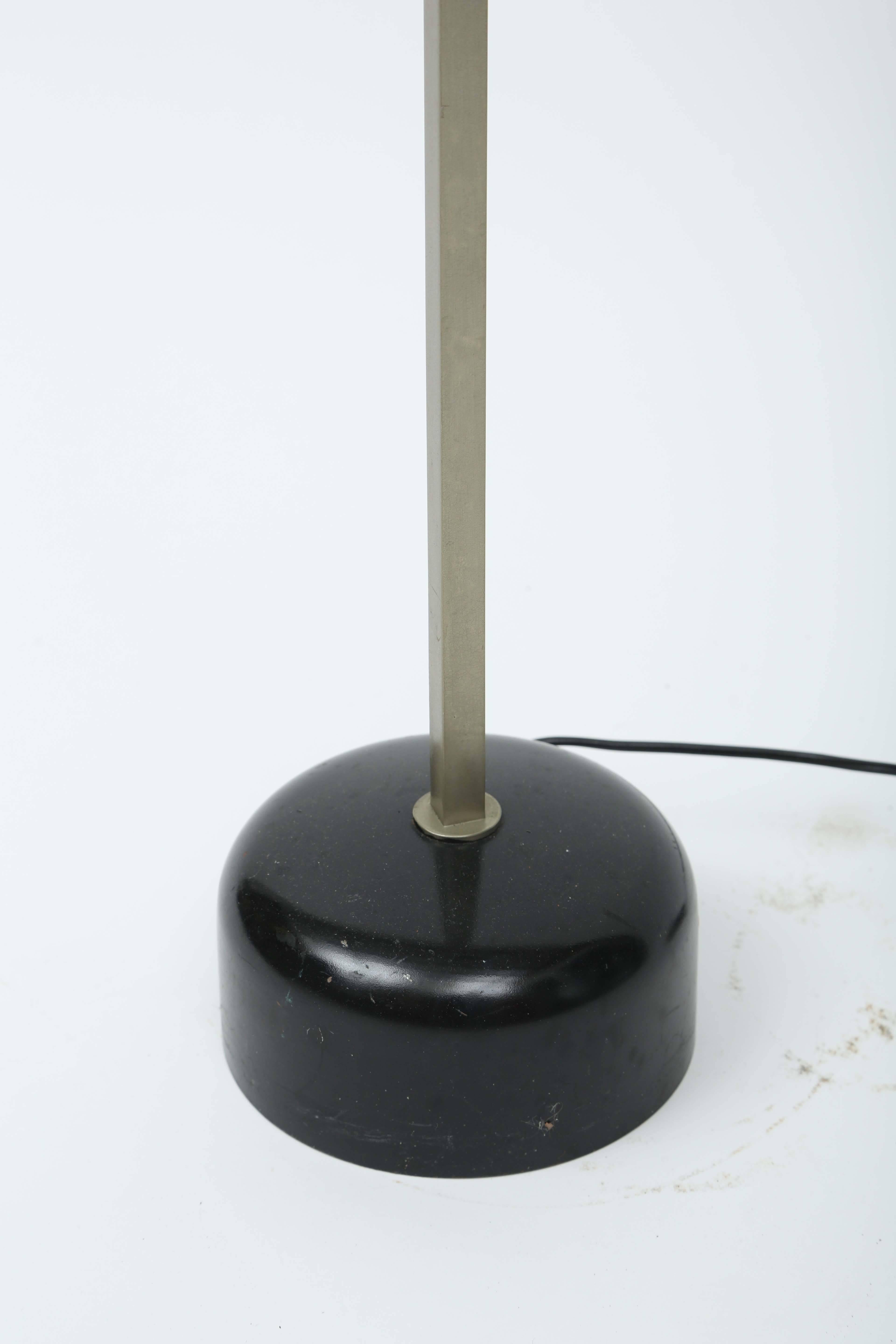 Pivoting magnetic floor lamp manufactured by Arredoluce
label below.