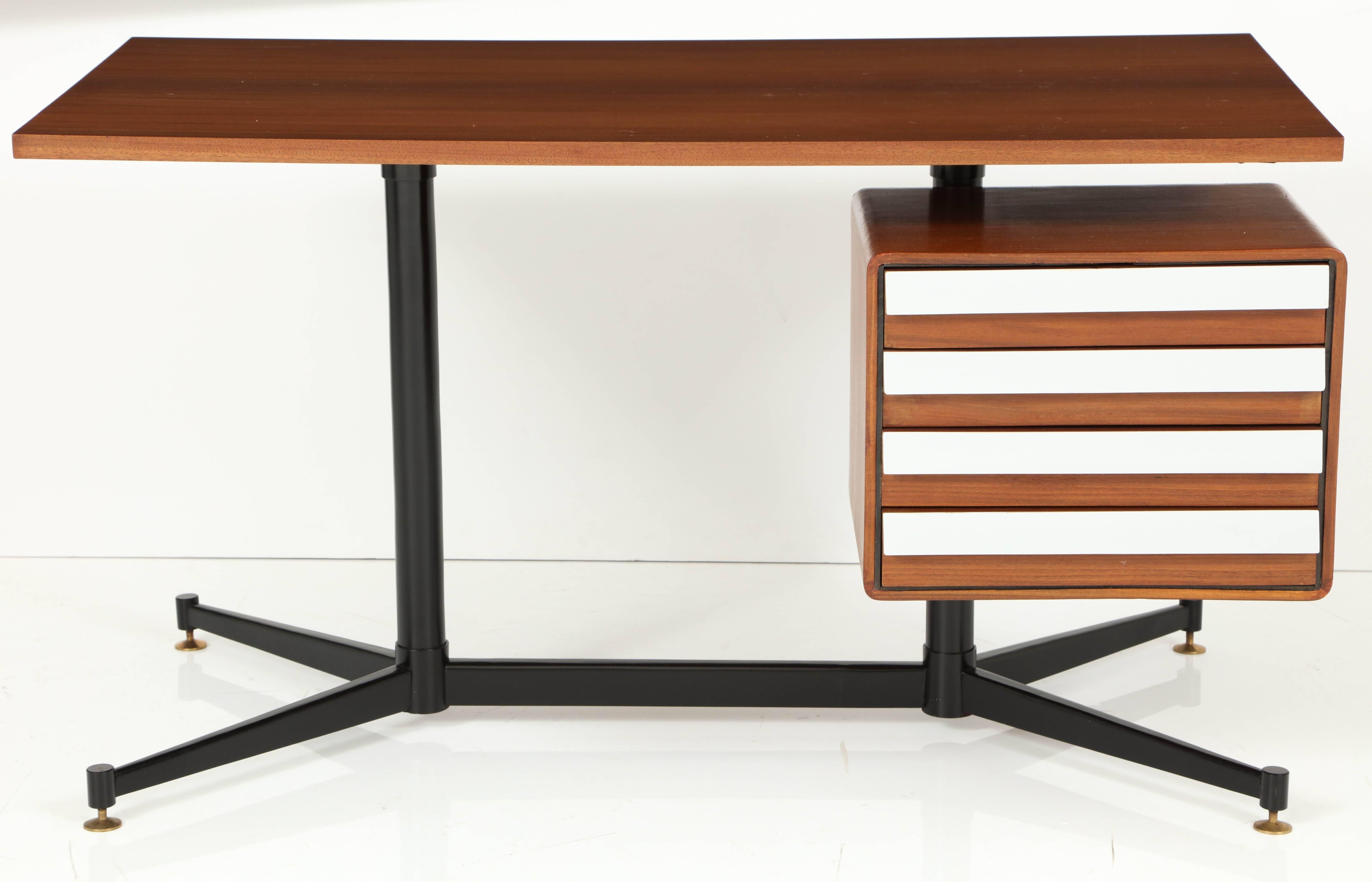 Small desk with heavy black lacquered metal frame and brass feet. The top is in rosewood and the drawer fronts have the original formica facing. This model is a similar design to that of Gio Ponti.