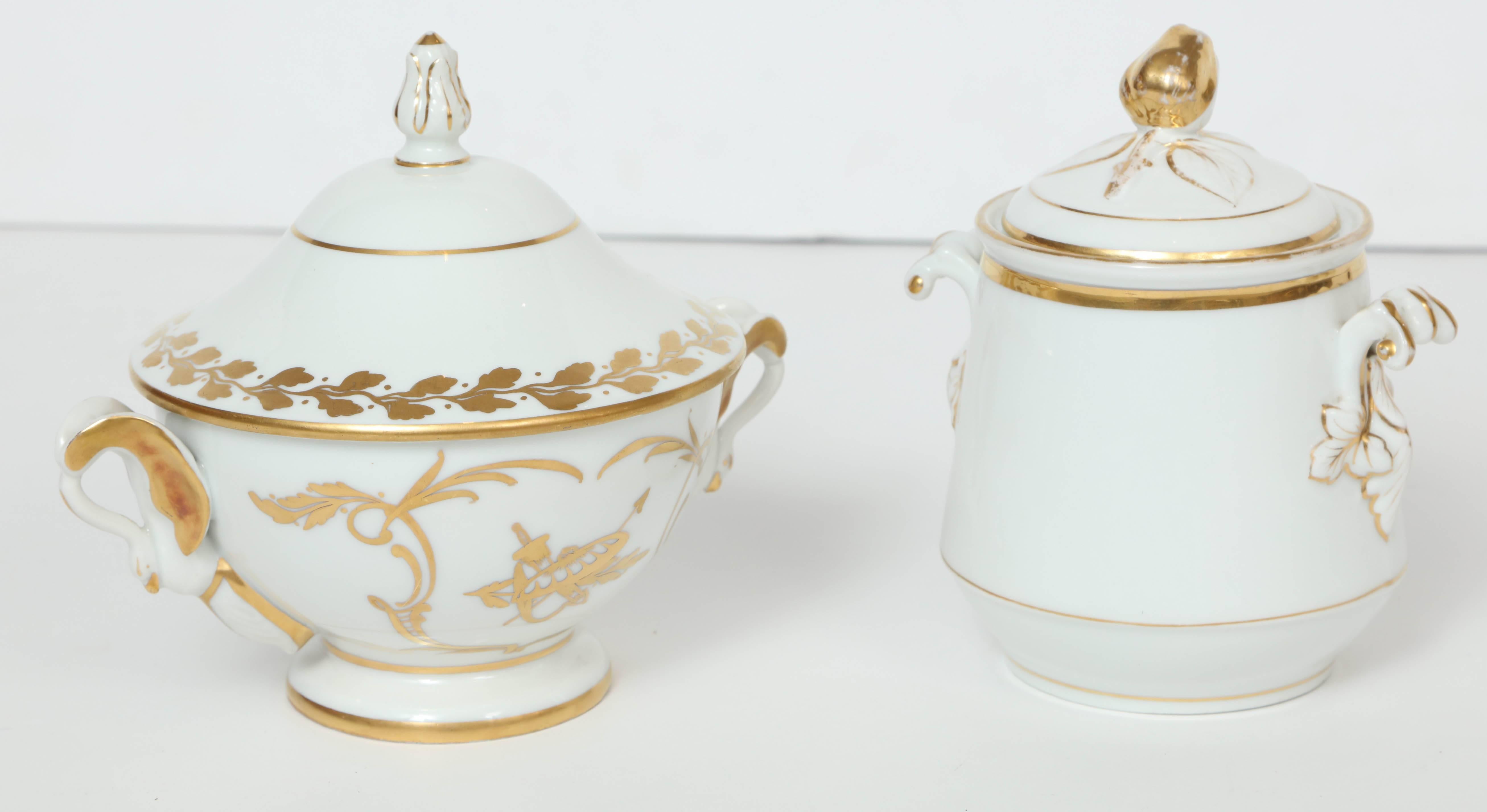 Set of two white porcelain serving pots with 22-karat gold decoration. Perfectly sized for serving jam, jelly, compote, sauces or sugar. 

Bowl on left measures: 7.5